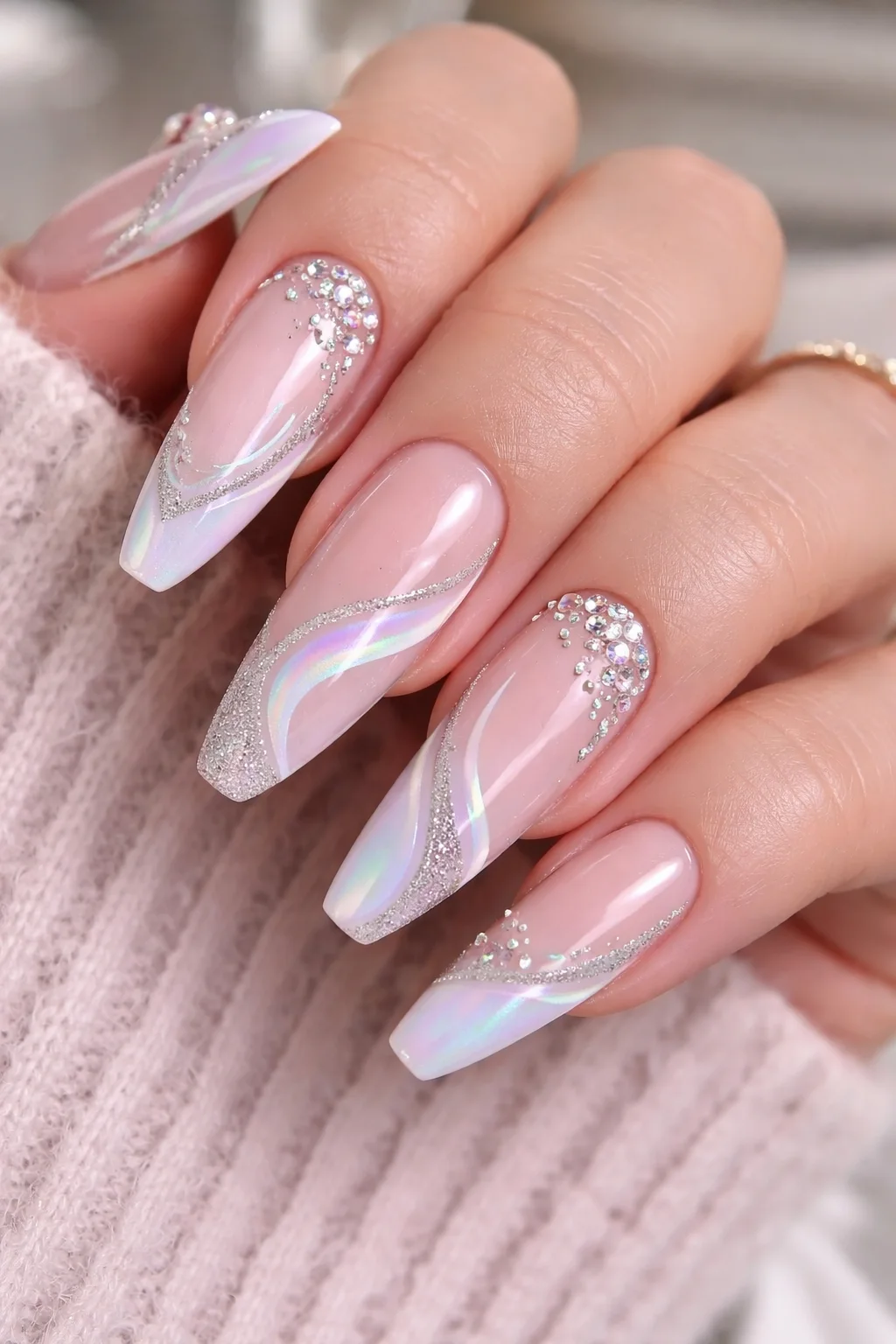 iridescent french swirl nail design with glitter lines and crystal accents