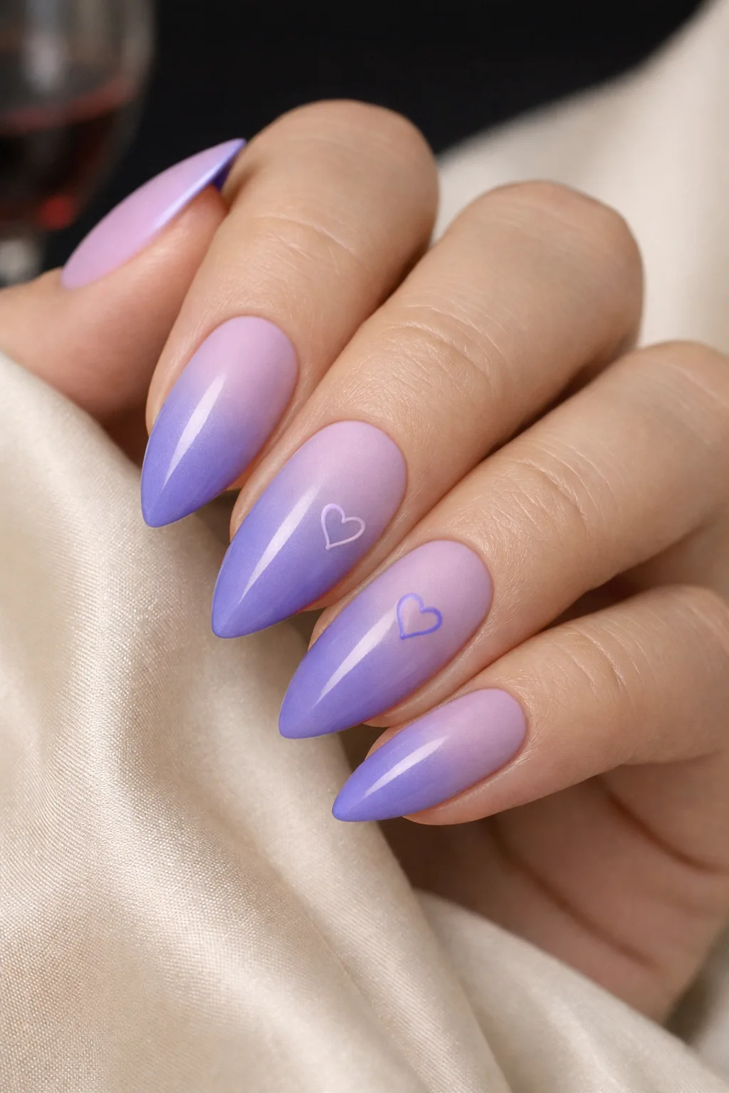 Lavender ombre Valentine nail design with soft purple gradient and minimal heart art on almond nails