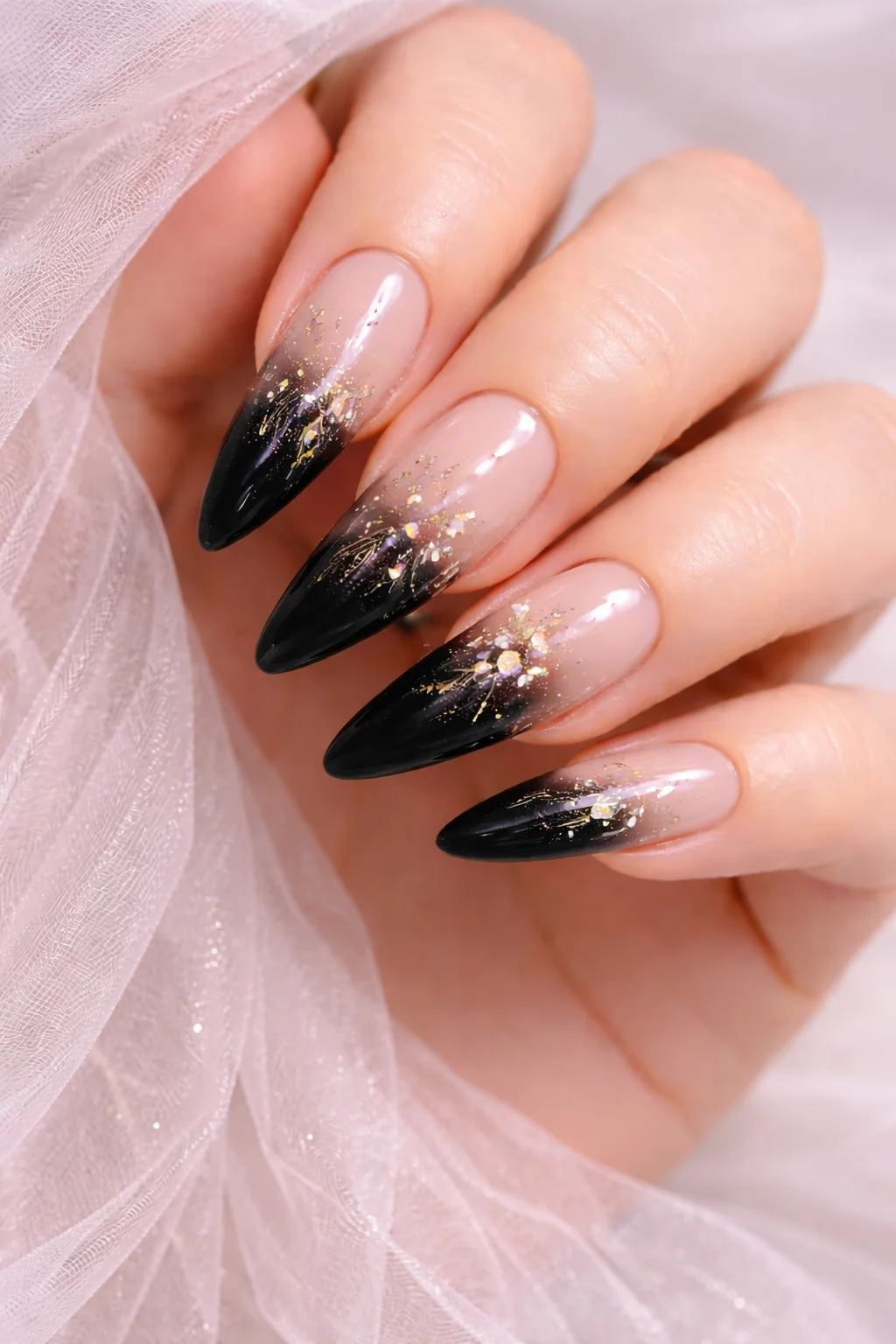 Black ombre bridal nails with gold foil sparkle for a modern wedding style