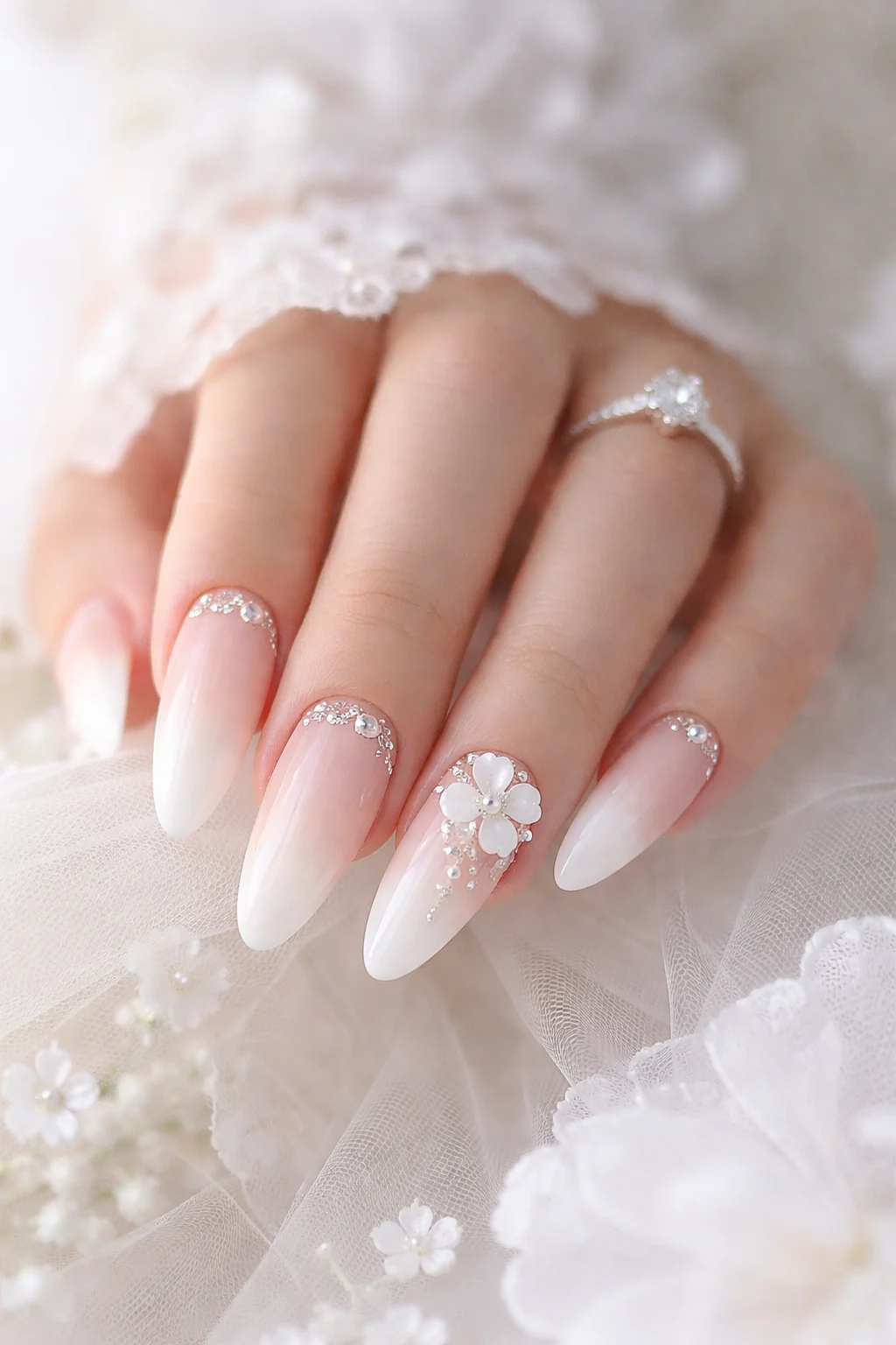 White and blush ombre Valentine nails with floral pearl and crystal details