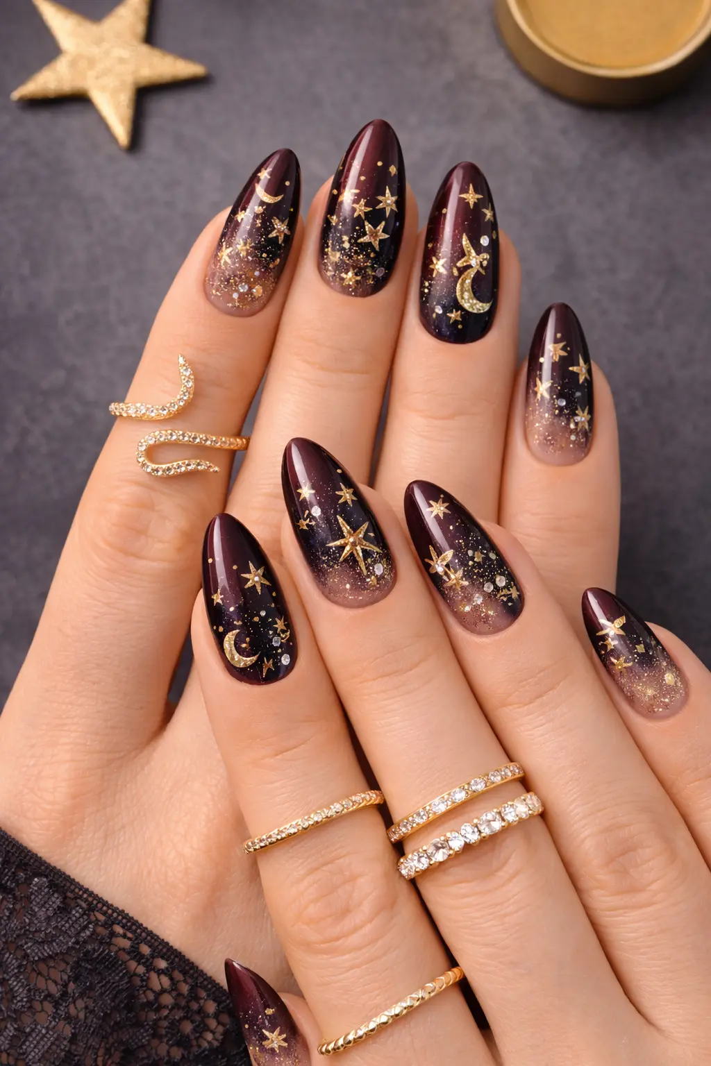 galaxy star nail design with gold moon details and glitter finish