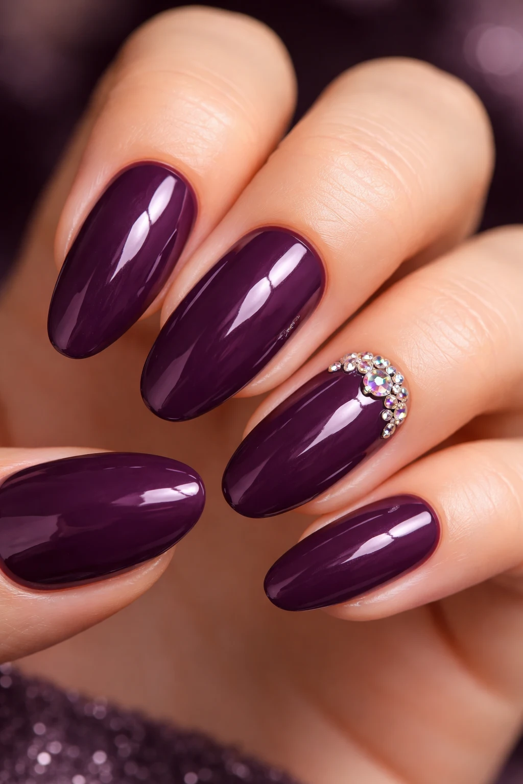 Deep plum bridal nails with minimal crystal detail for an elegant wedding style