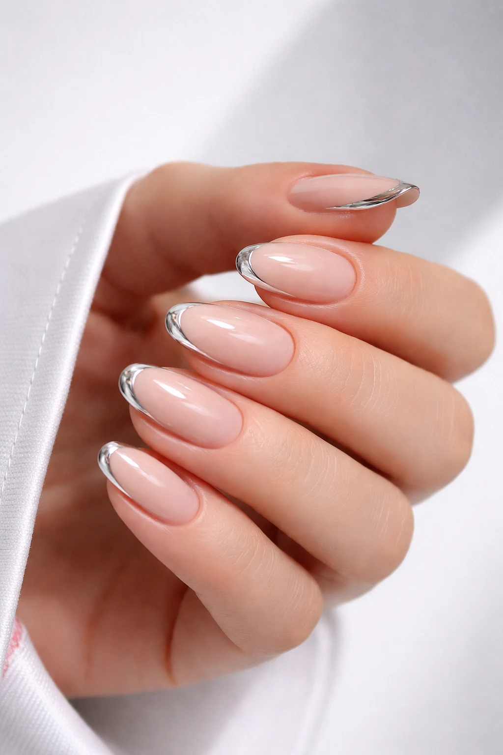 silver edge minimal winter nails nude nails with chrome tips modern french nails elegant winter manicure