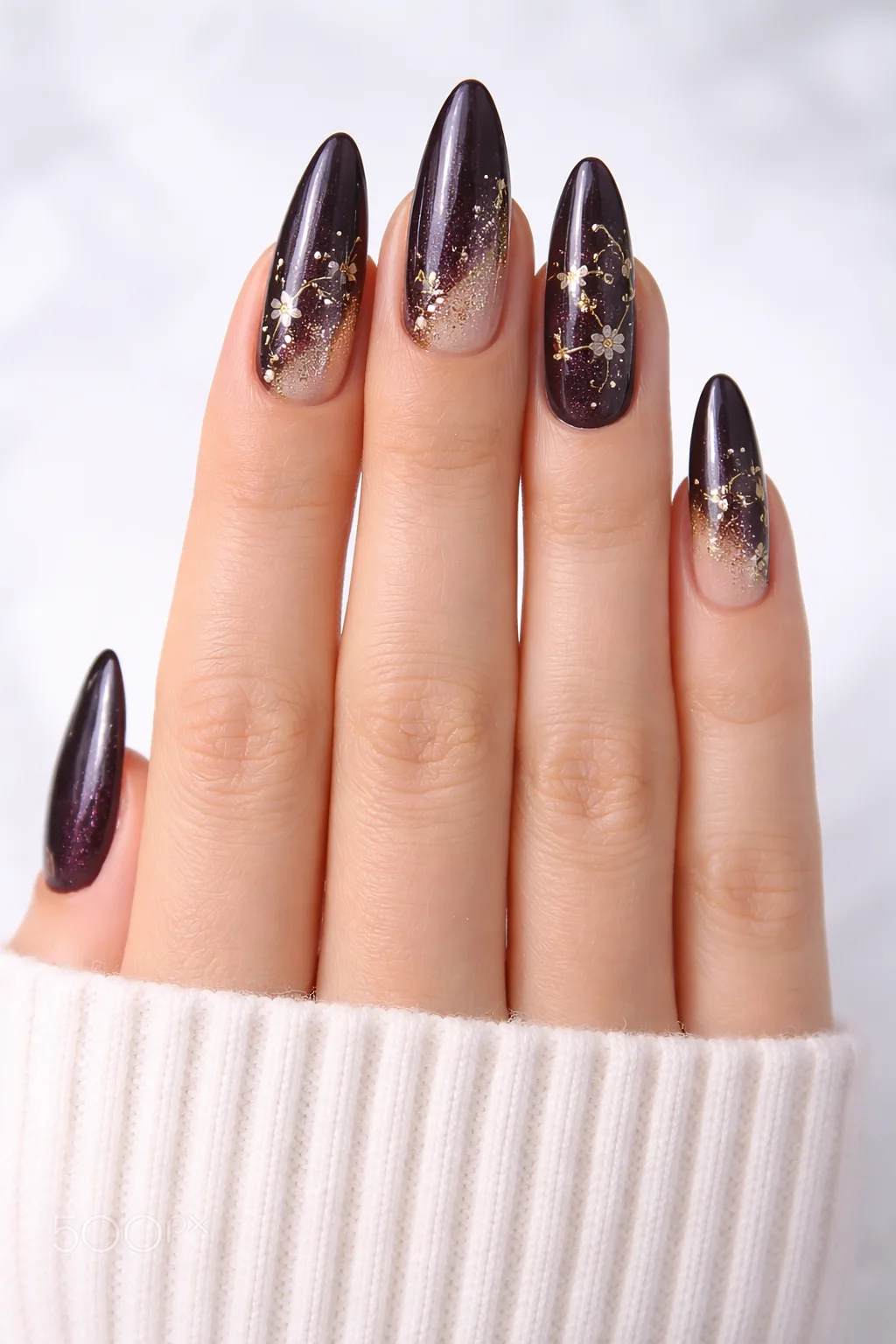 dark brown ombre nails with gold floral details and glossy finish