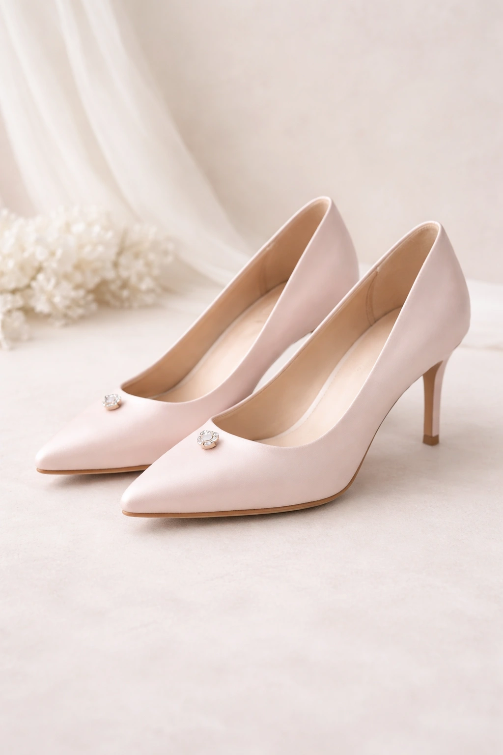 Soft satin bridal heels with pointed toe and pencil heel for elegant weddings