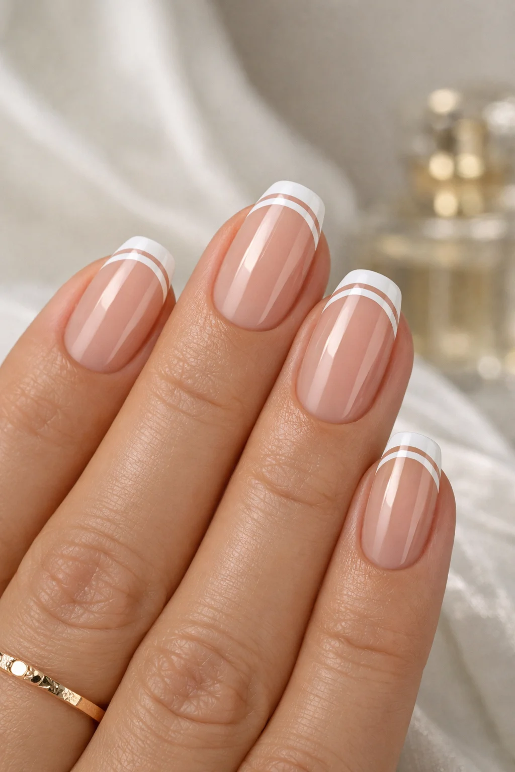 double line french tip nude gel almond nails glossy natural manicure