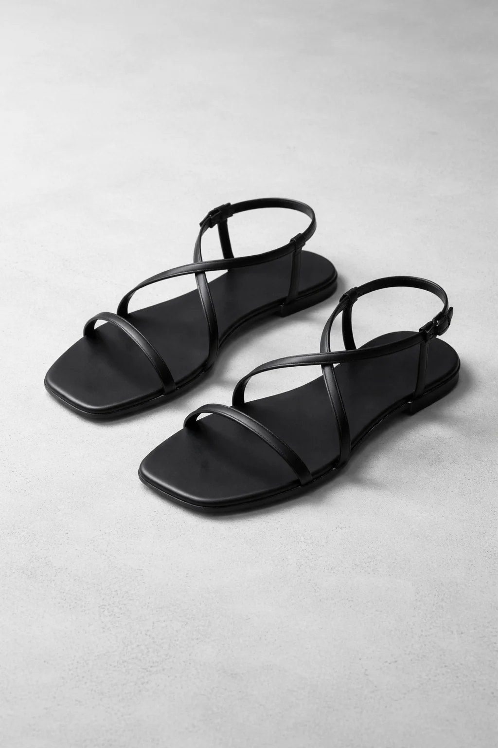 Black minimal flat girls sandal with thin straps and square toe design