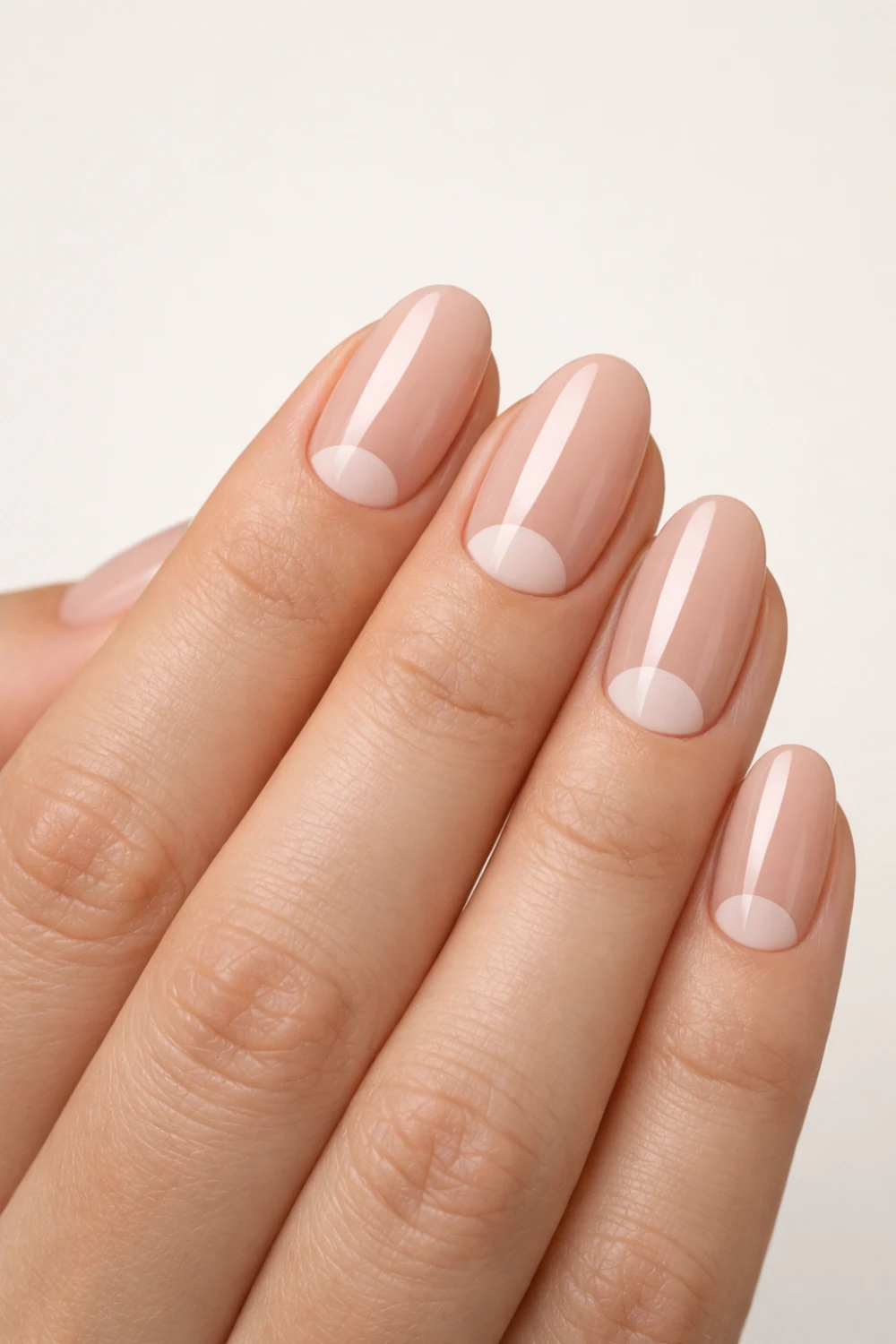nude half moon minimalist nails clean formal manicure modern neutral nail trend