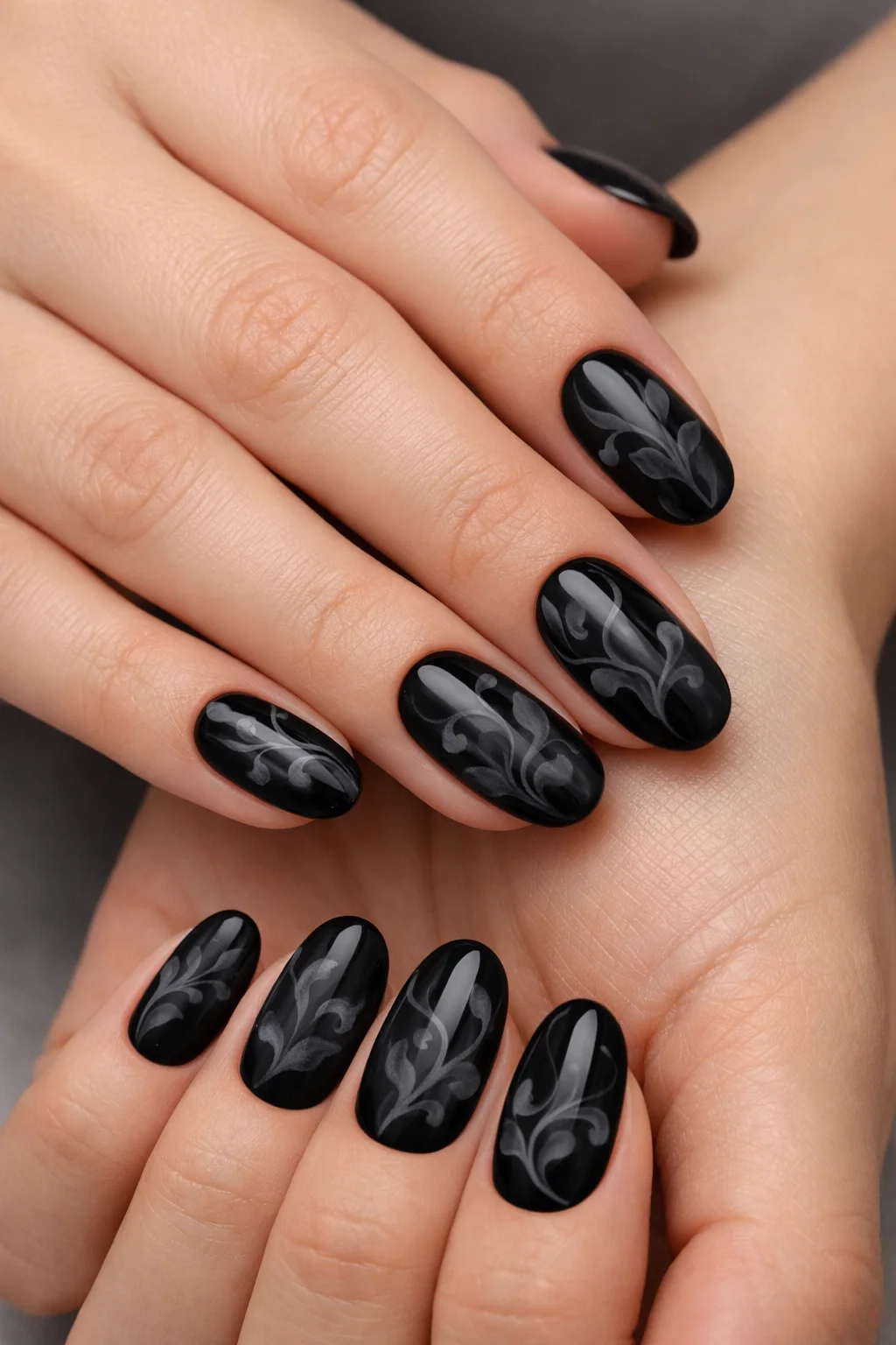 Midnight black blooming gel nail art with smoky gray vine design glossy manicure