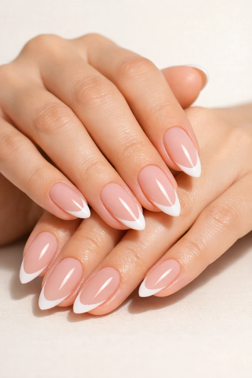 almond nude french tip nails classy formal manicure elegant neutral nail design for weddings