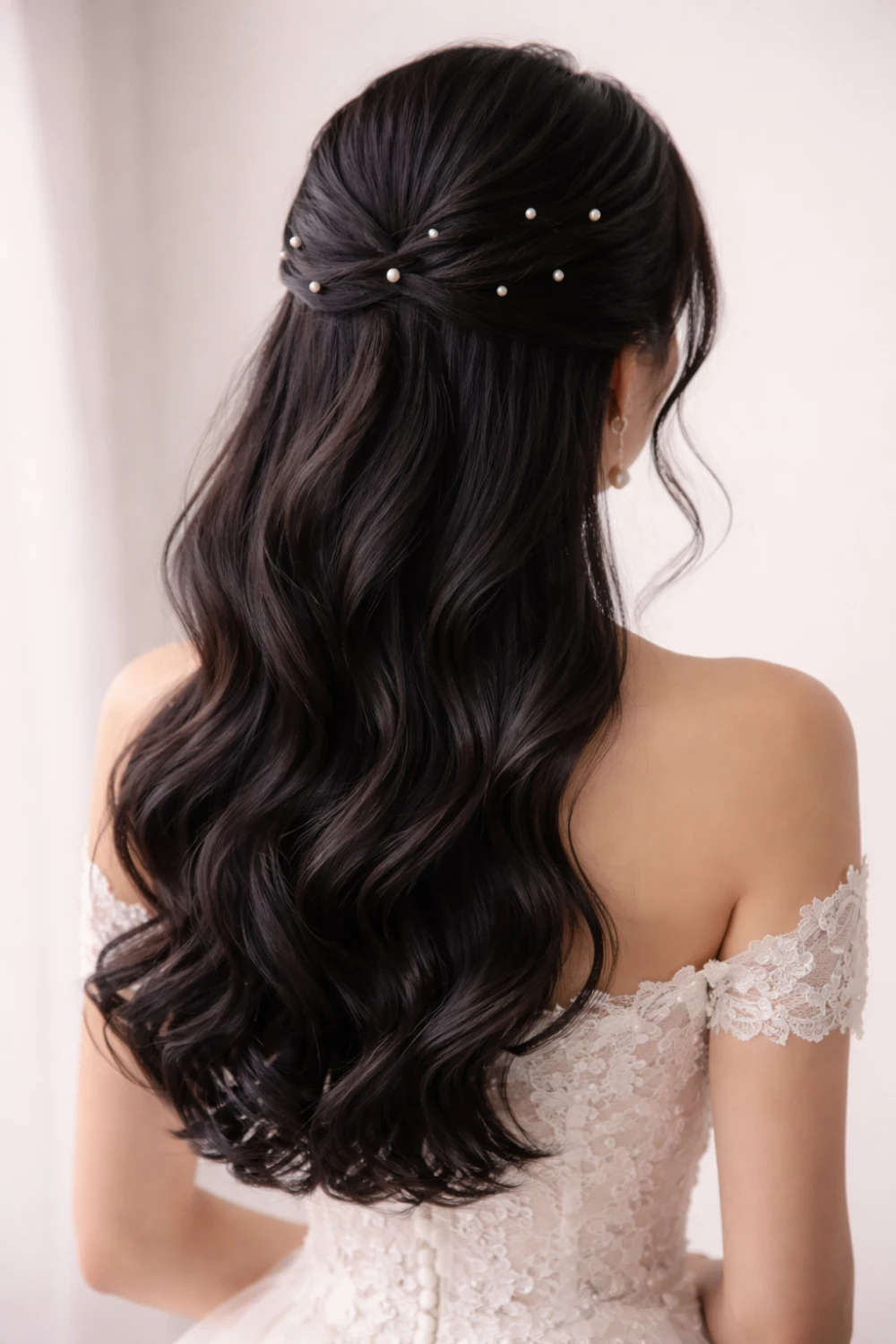 loose romantic twist half up half down bridal hairstyle with waves