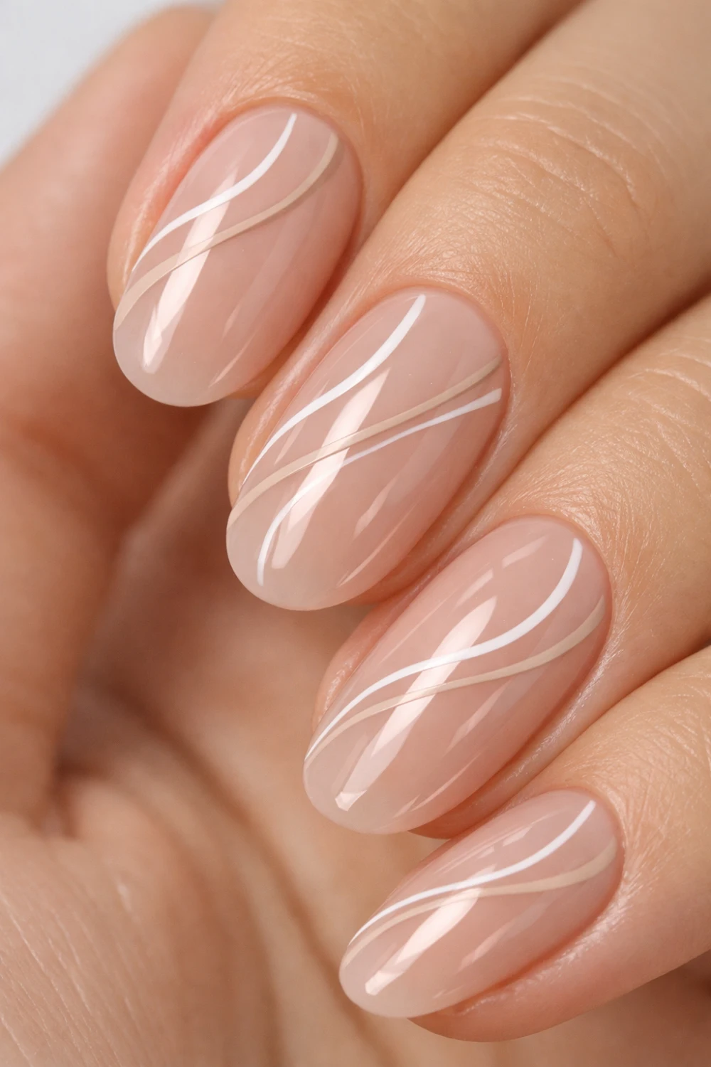 minimal nude swirl gel nails for eid, glossy neutral manicure with white abstract lines, modern pakistani gel nail design