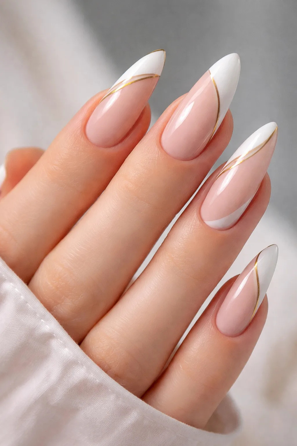 white french tips gold line accent almond gel nails luxury manicure