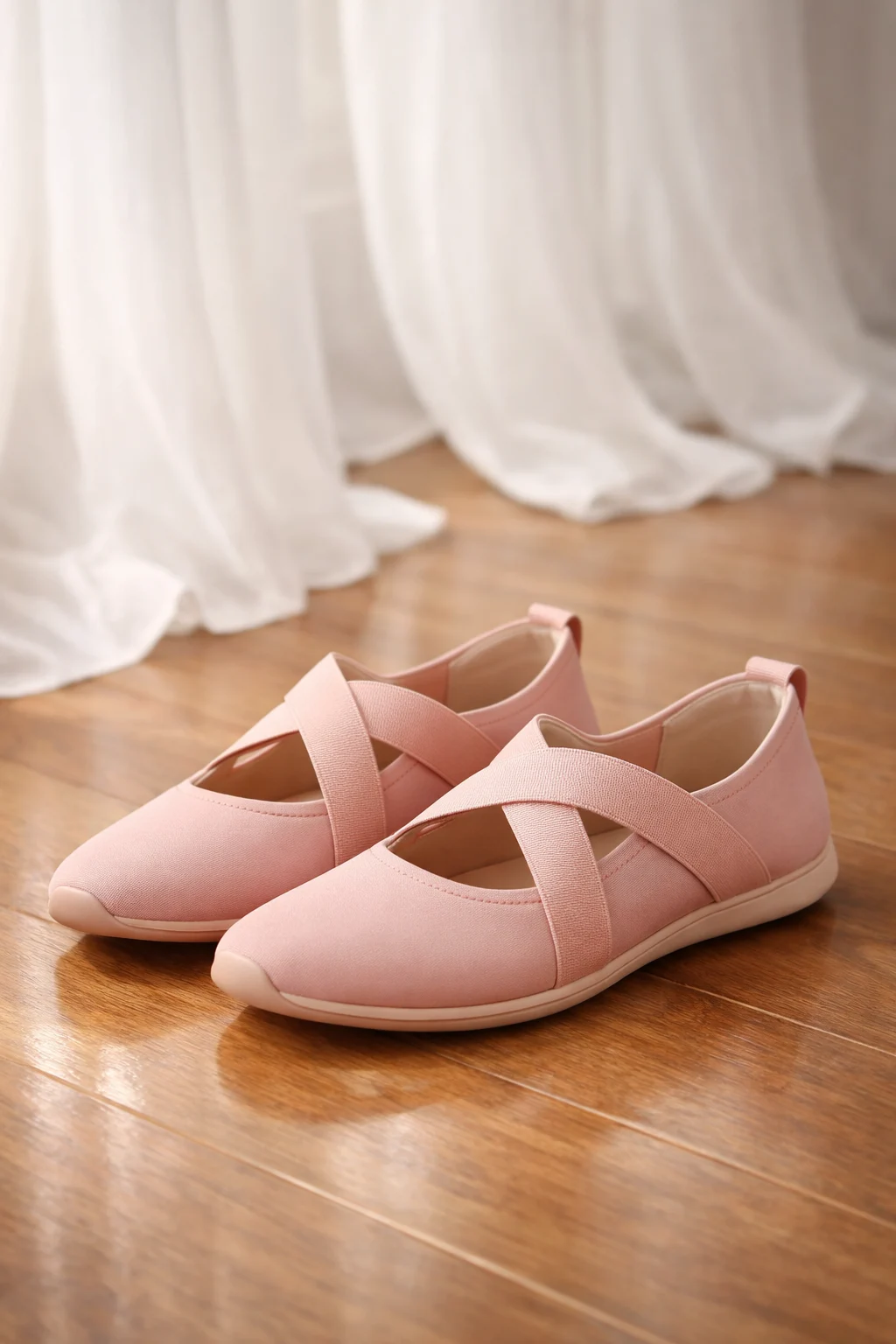 soft pink ballet style girls sneakers with cross strap lightweight flexible indoor casual shoes wooden floor