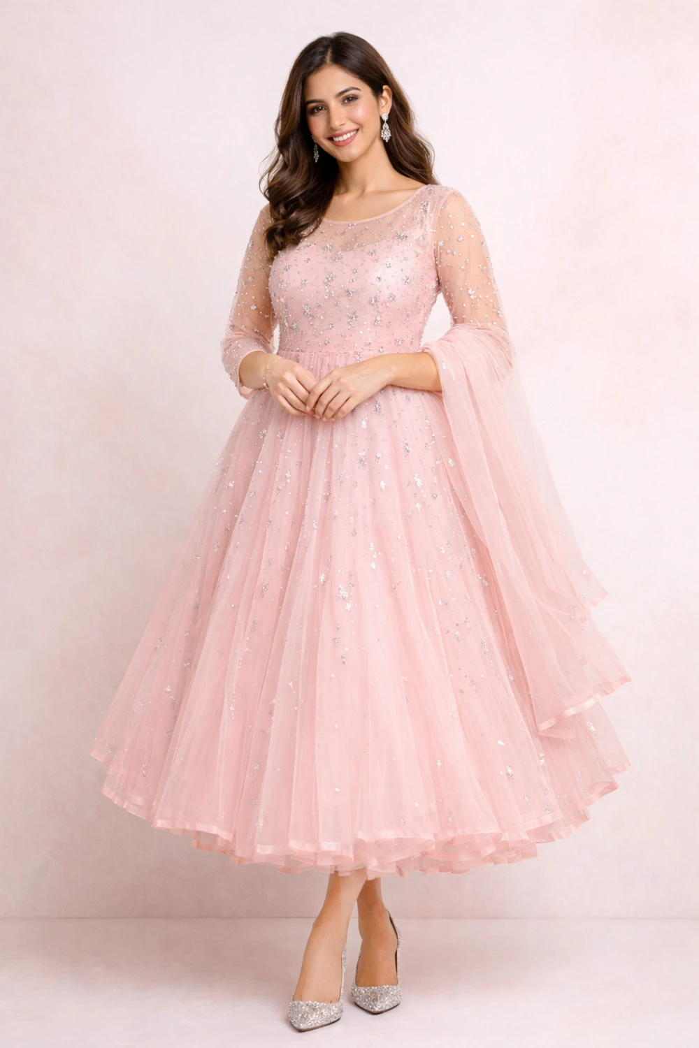 Blush pink sparkle Eid dress for women with layered flare and sequin detailing, soft glamorous Pakistani festive outfit