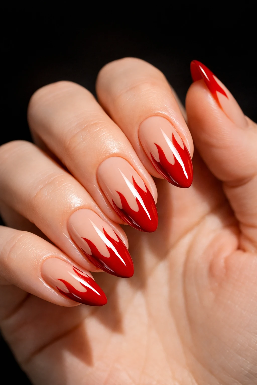 Nude nails with bright red flame tips bold edgy fire inspired summer nail art design