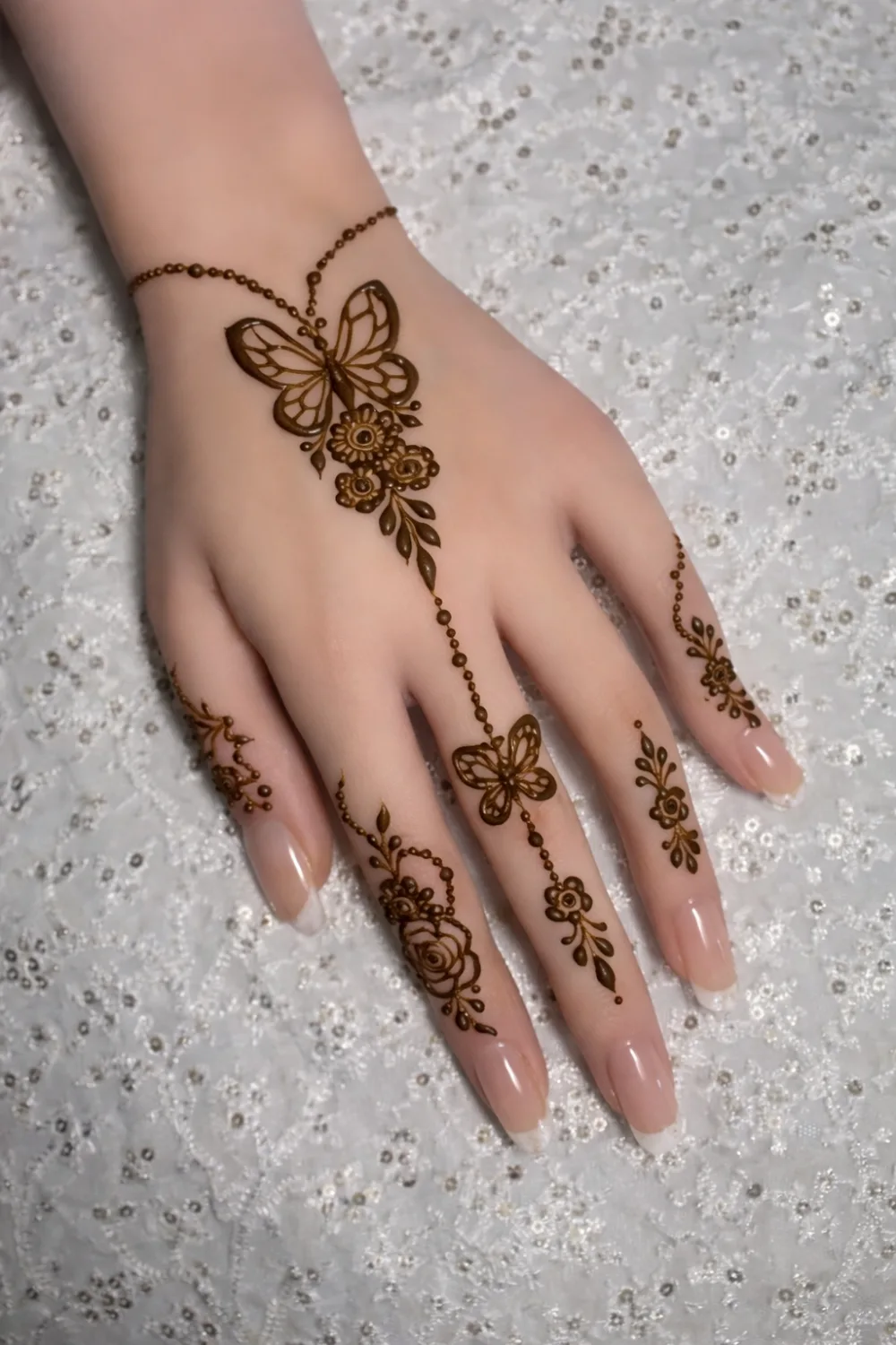 butterfly chain mehndi design minimal cute modern henna style