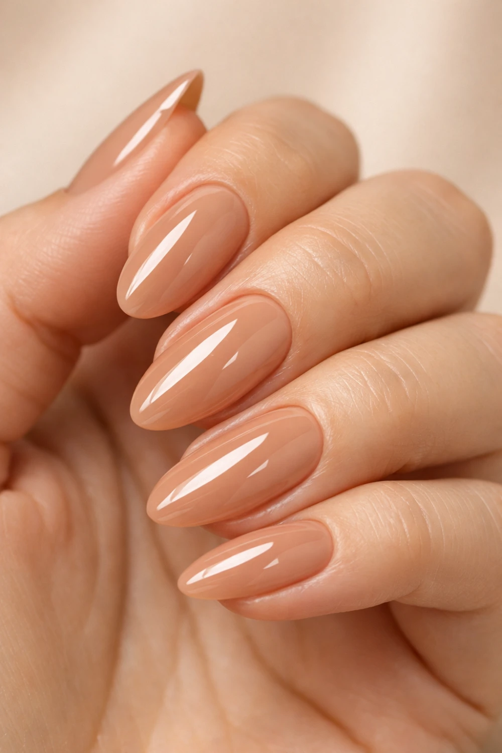 glossy caramel nude almond nails warm neutral manicure