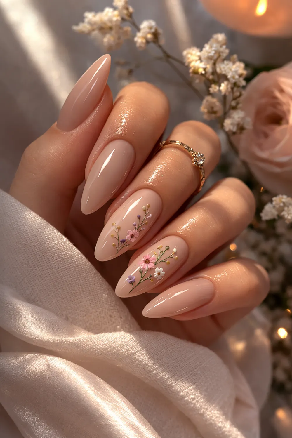 nude almond nails with delicate floral nail art spring manicure