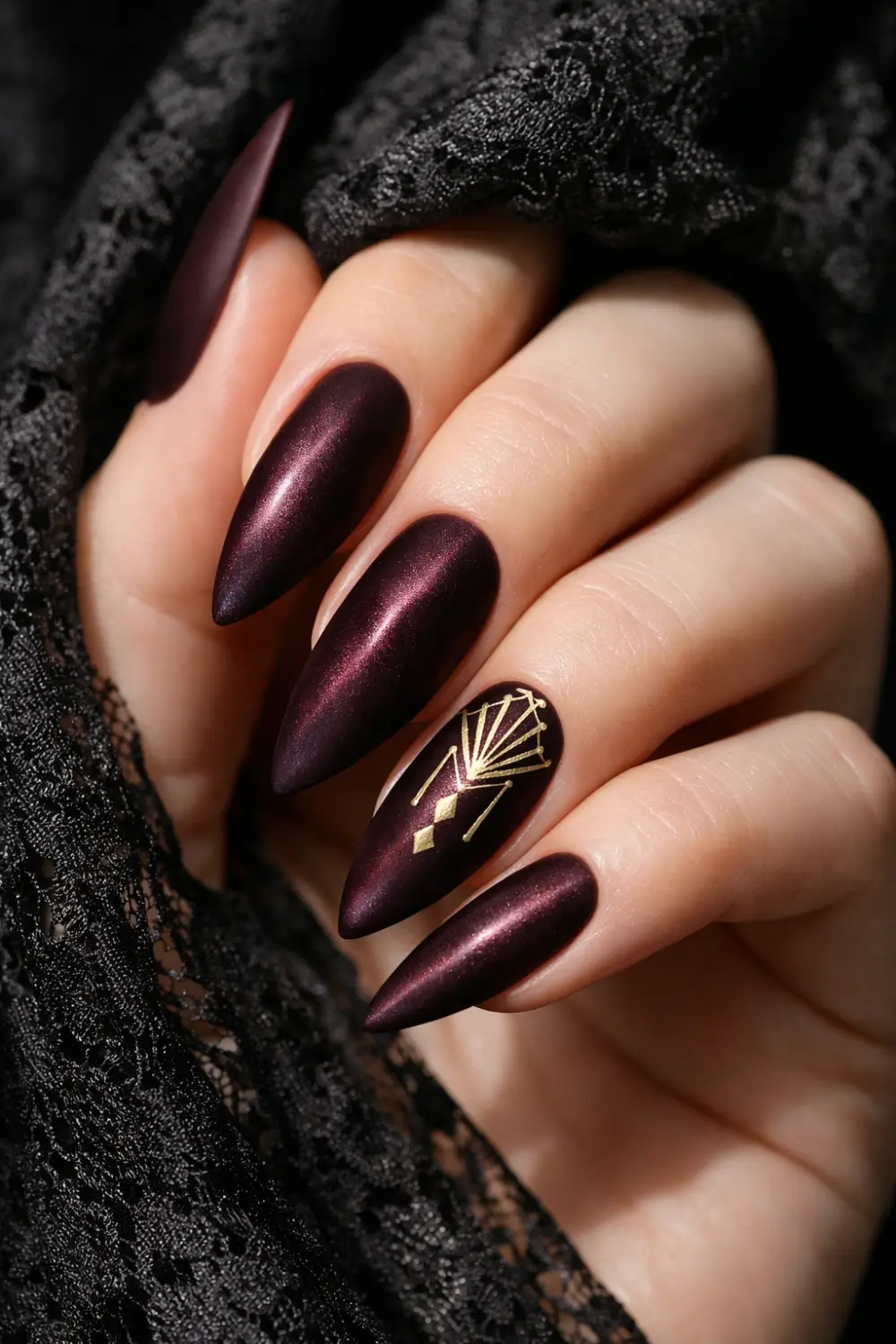 deep burgundy chrome ombre nails with gold line art luxury nails
