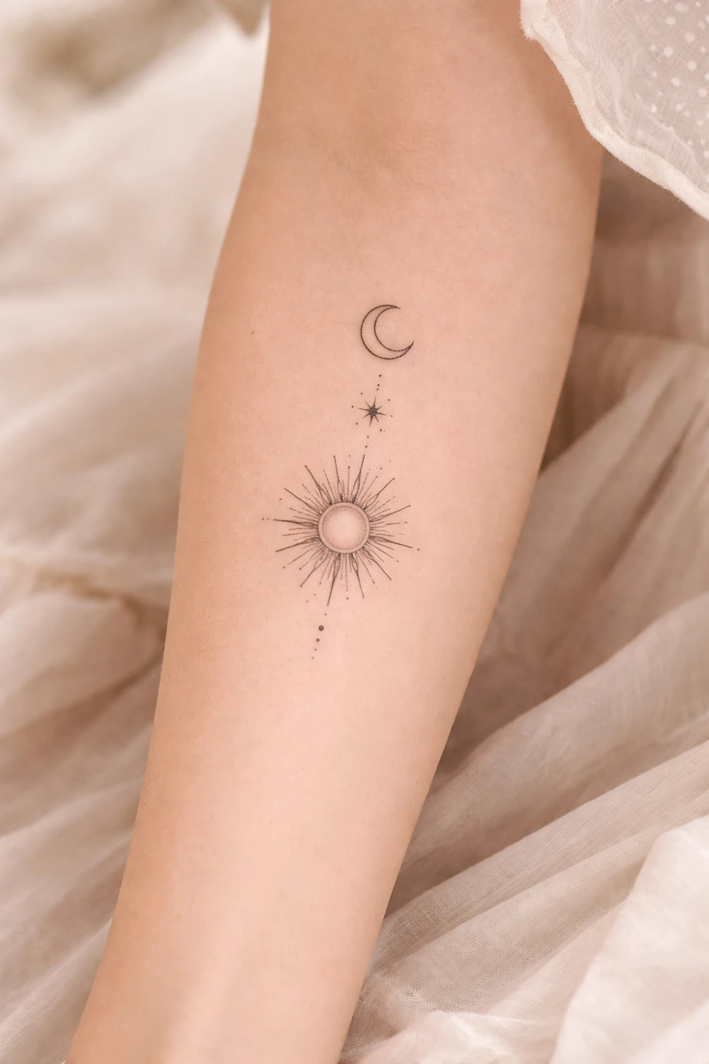 sun and moon forearm tattoo with fine line celestial details, minimalist cosmic tattoo design symbolizing balance harmony and duality placed along the forearm