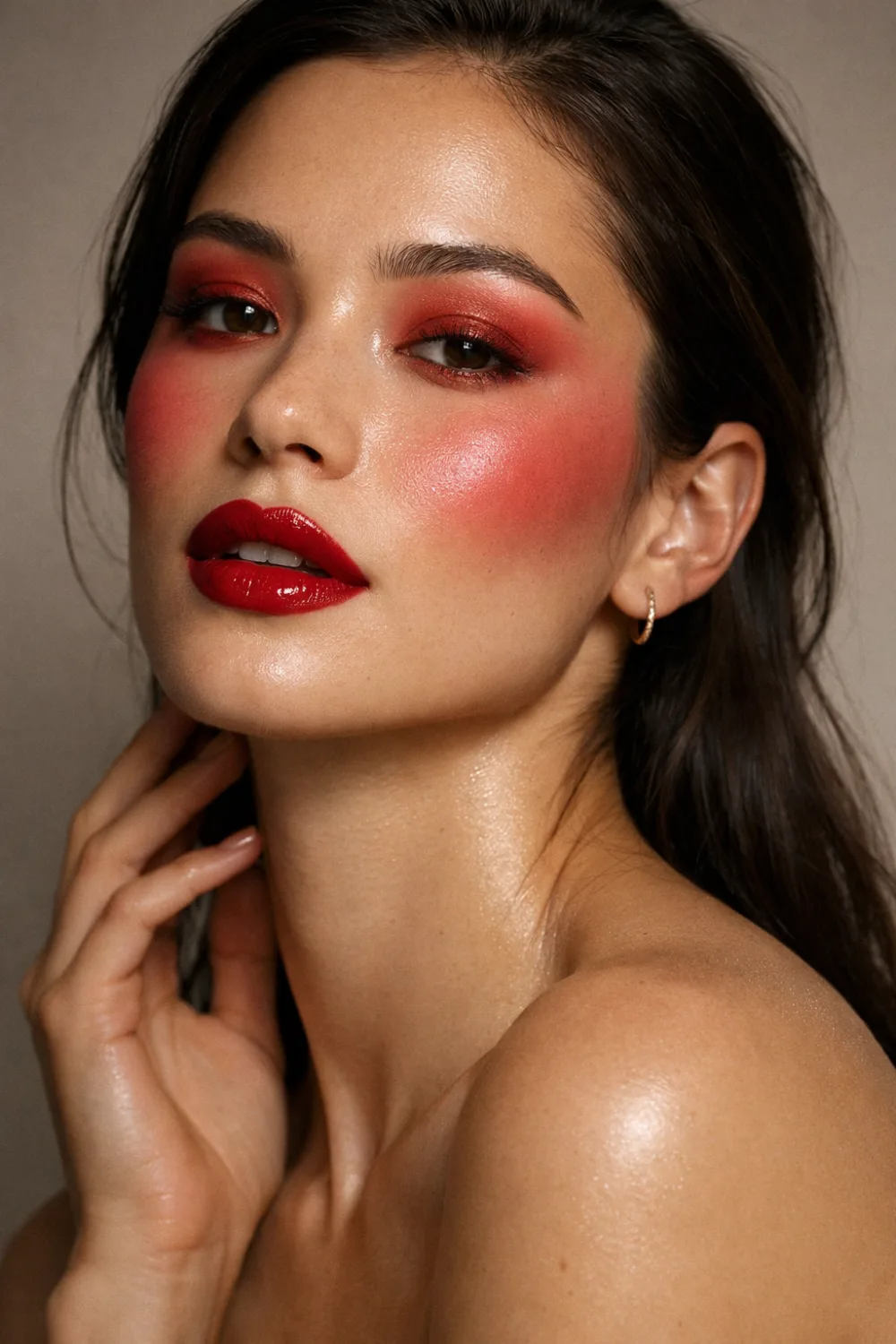 Monochrome cherry red makeup look with red eyeshadow blush and lipstick creating a cohesive glamorous beauty style perfect for bold makeup inspiration