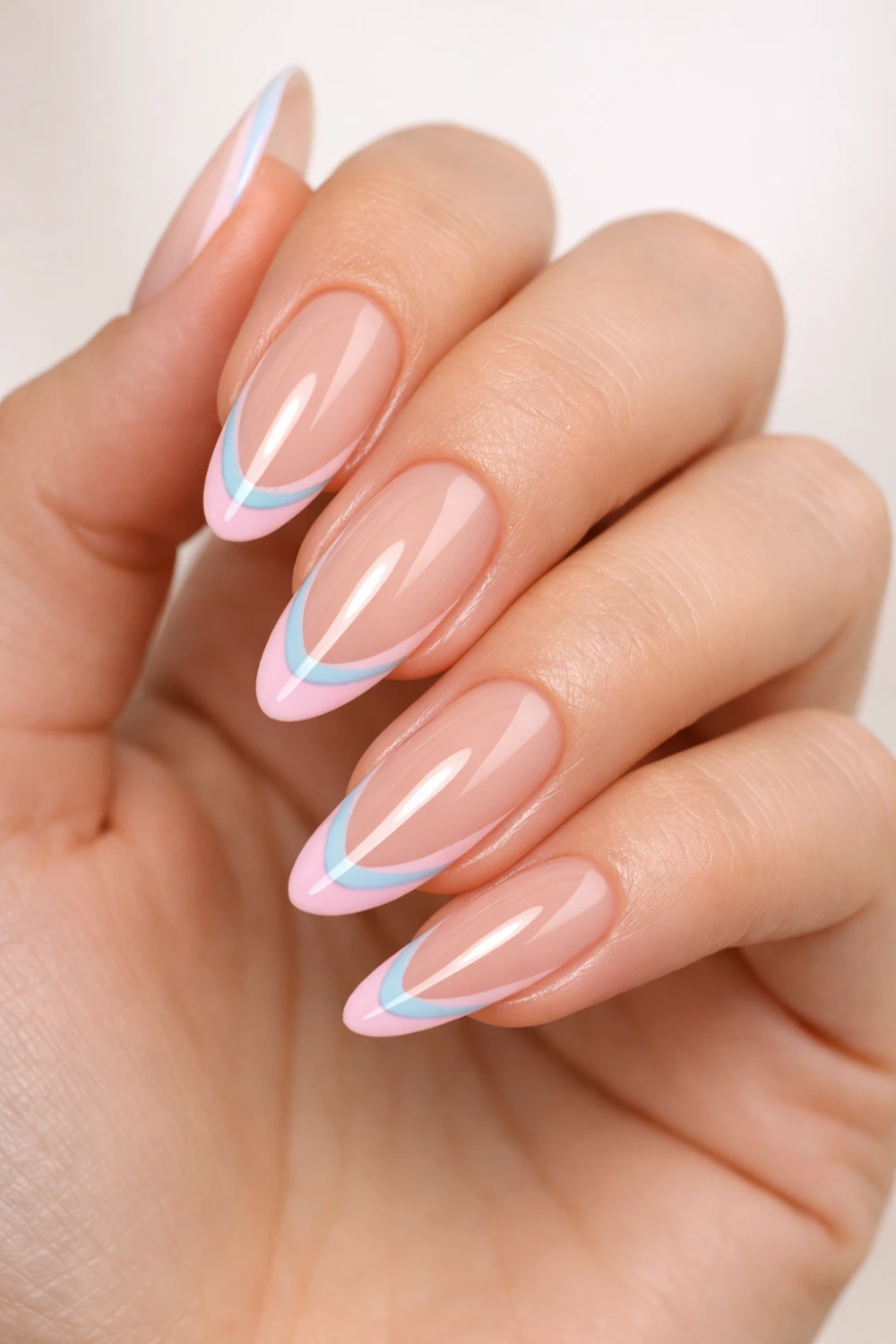 pastel swirl french tip almond nails pink blue spring nail design