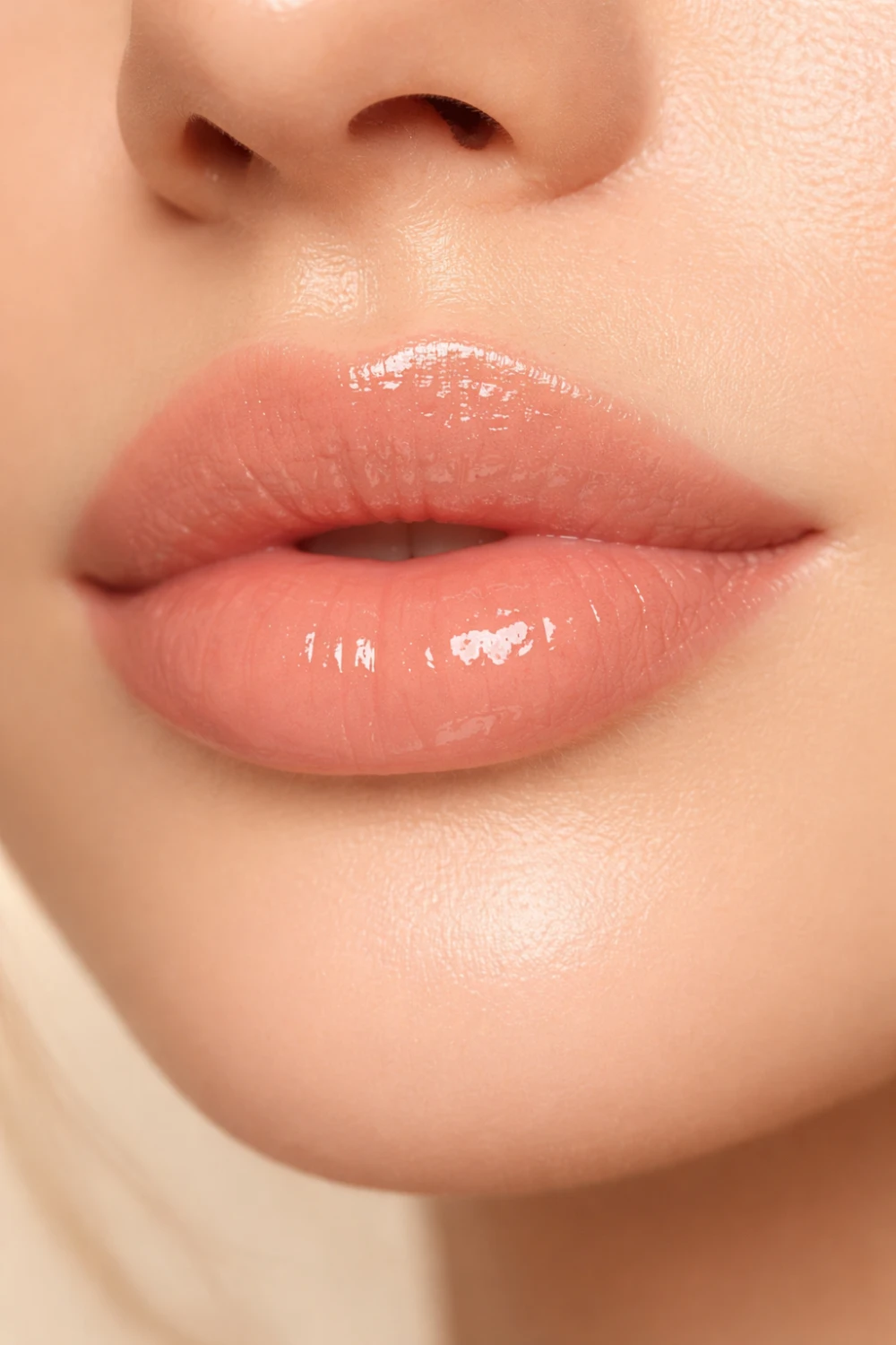 Glossy nude lipstick on hydrated lips natural beauty makeup