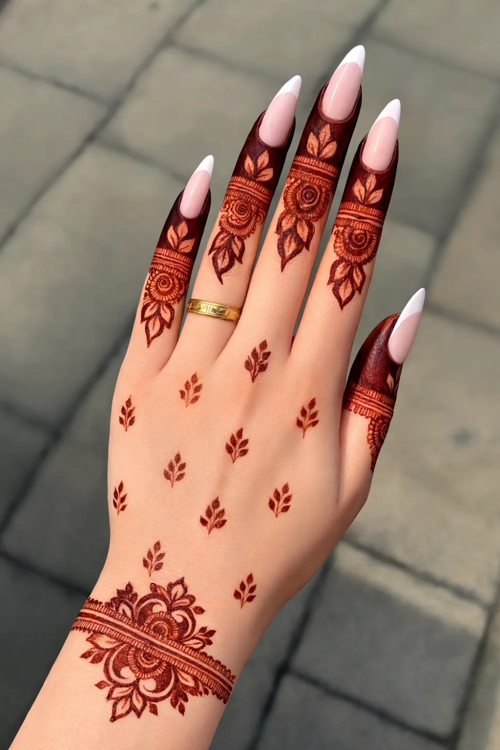 finger focus mehndi design with detailed finger patterns and floral wrist motif minimal modern henna style