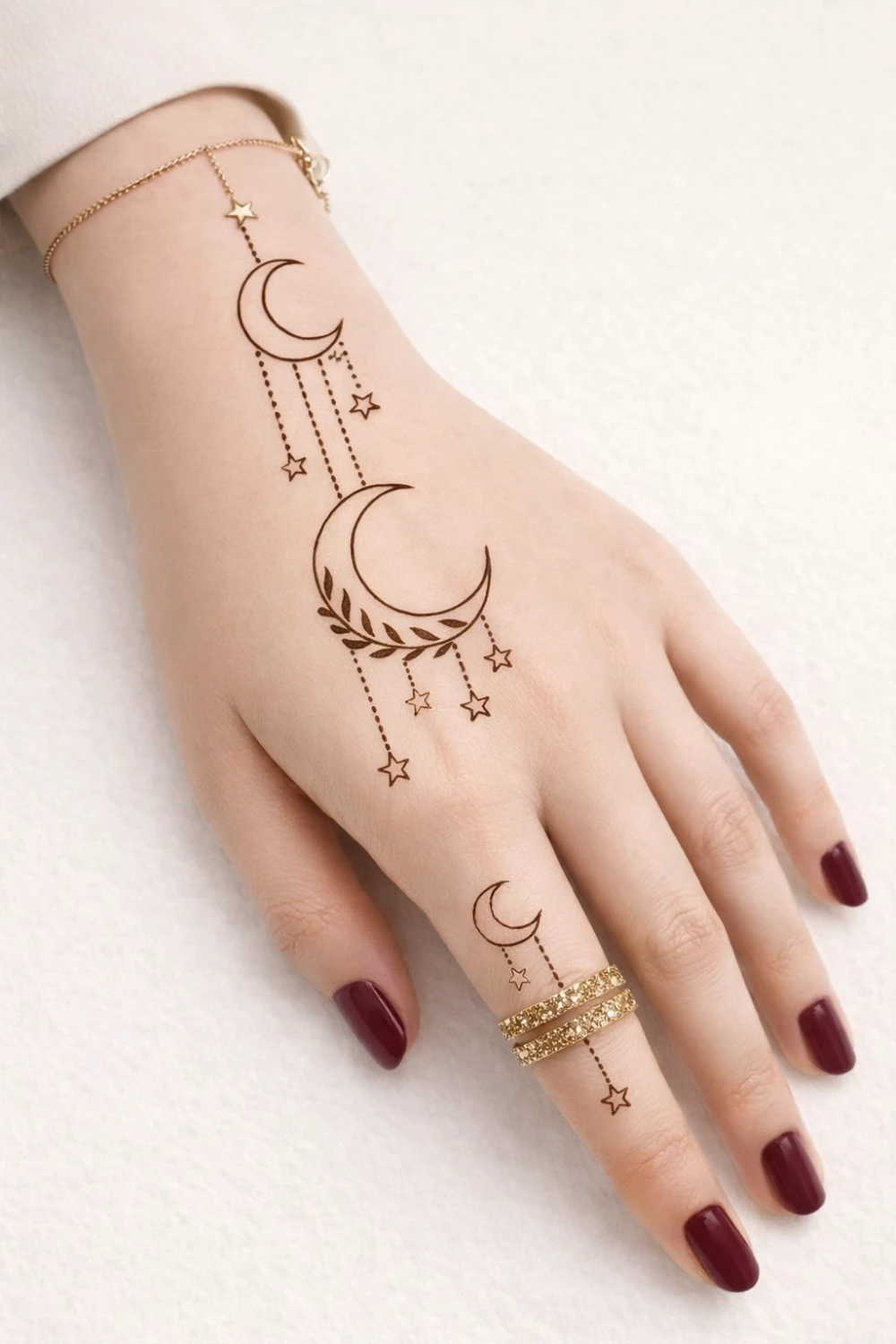 Minimal moon and star mehndi design with delicate dotted chains and small crescent motifs on the hand, simple Arabic henna style perfect for modern mehndi lovers and festivals.