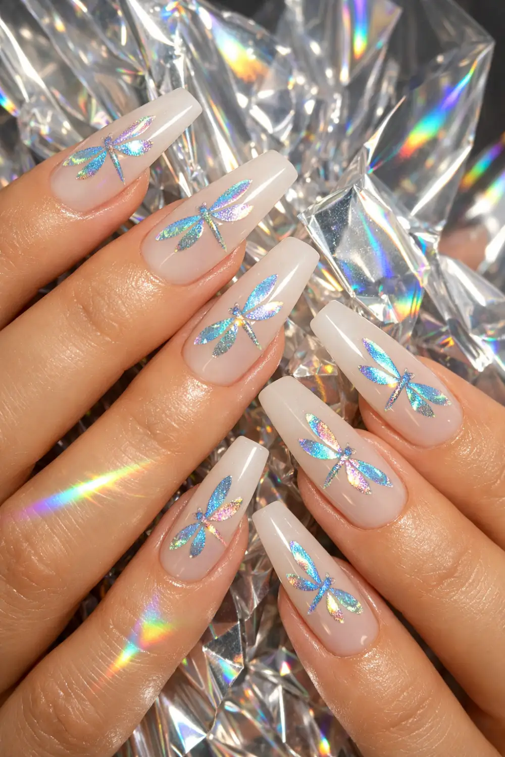 holographic dragonfly nail art on milky nails glossy shine modern manicure idea