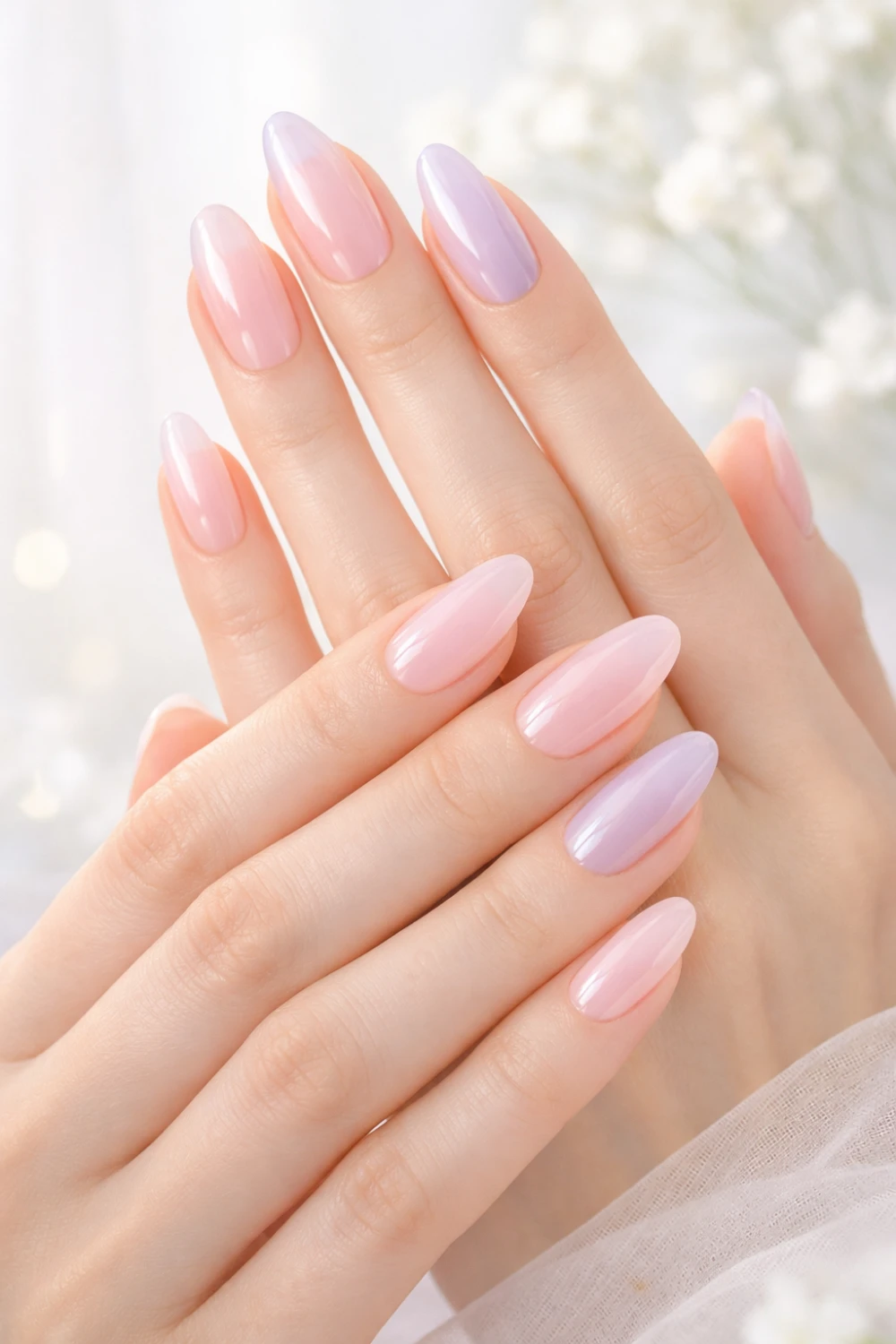 Almond-shaped nails with milky pastel pink and lavender tones on feminine hands, glossy finish, soft blurred background, clean elegant nail look