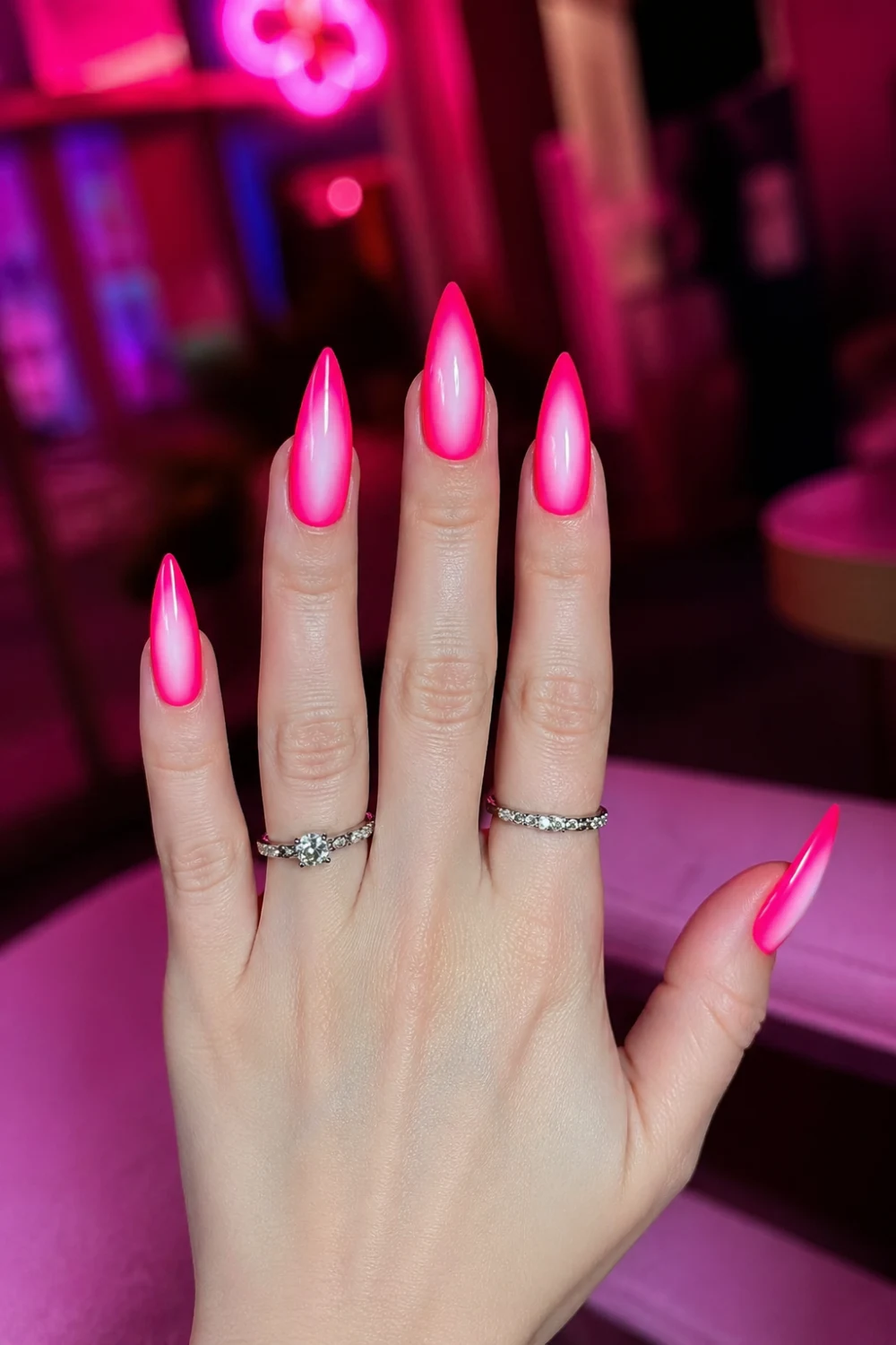 hot pink glow halo nails glossy stiletto gel nails bright pink edges soft white center glow bold vibrant manicure trendy statement nails