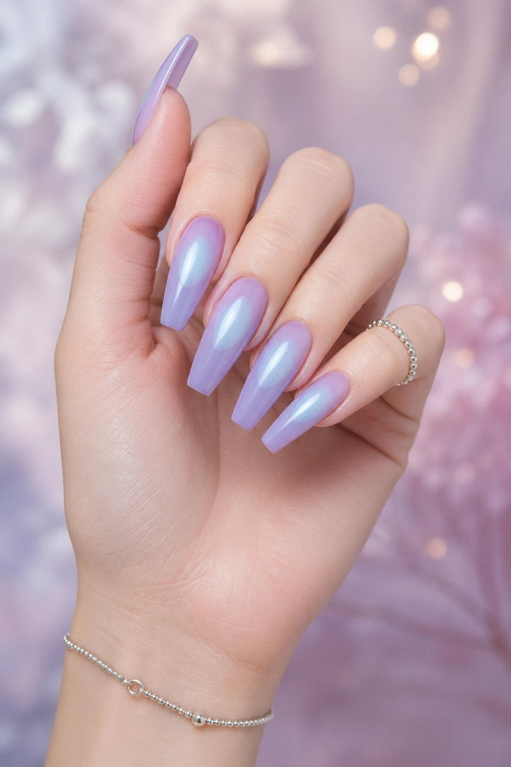 lavender blue aura halo nails glossy coffin gel nails pastel purple base glowing blue center soft gradient dreamy nail design trendy aesthetic nails modern manicure ideas