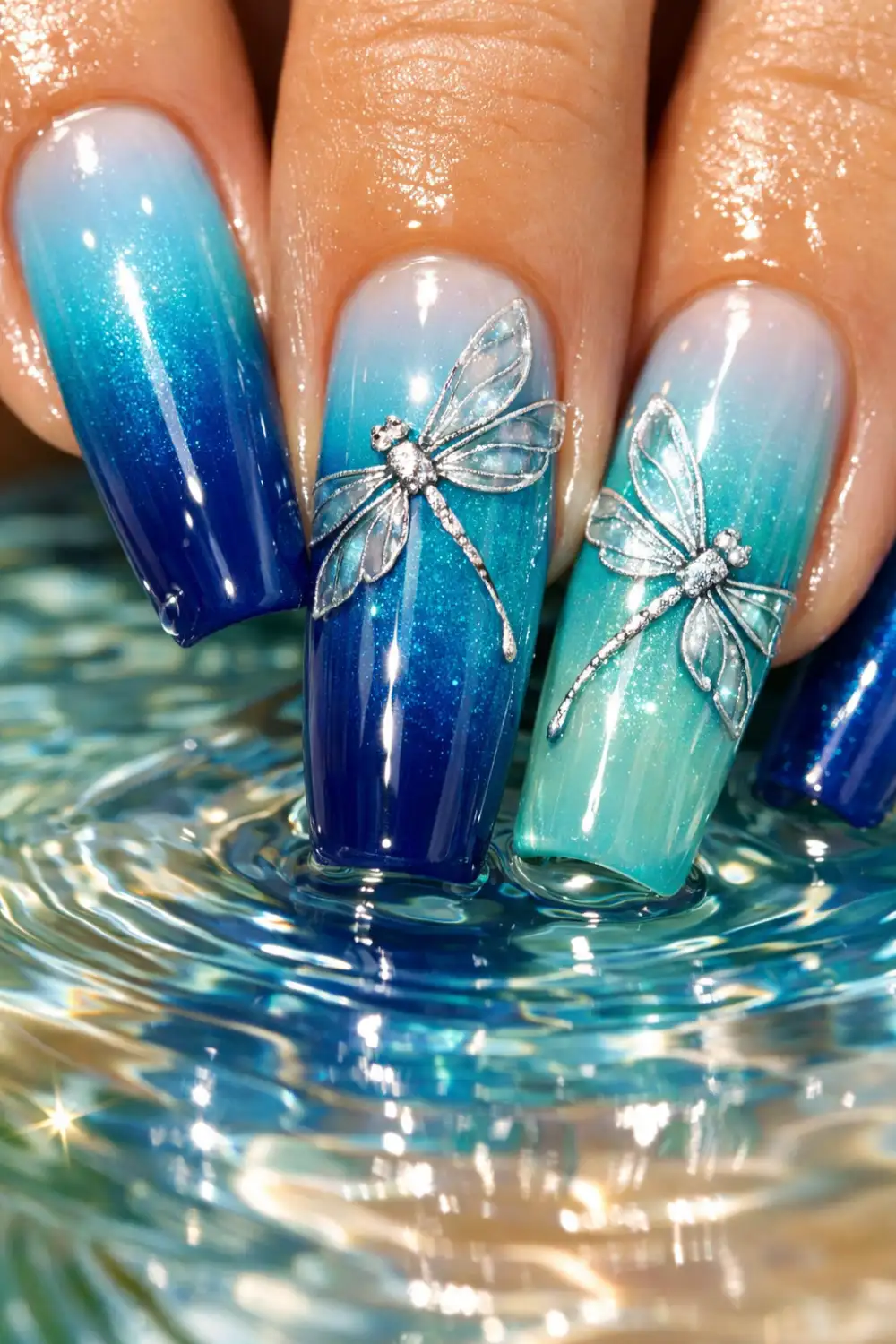 blue ombre dragonfly nail art with glossy gradient ocean nails trendy summer manicure inspiration