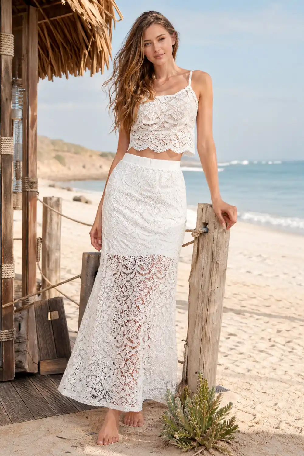 white lace two piece beach outfit, lace crop top and skirt set, summer beach fashion look, feminine vacation outfit, elegant coastal style clothing inspiration