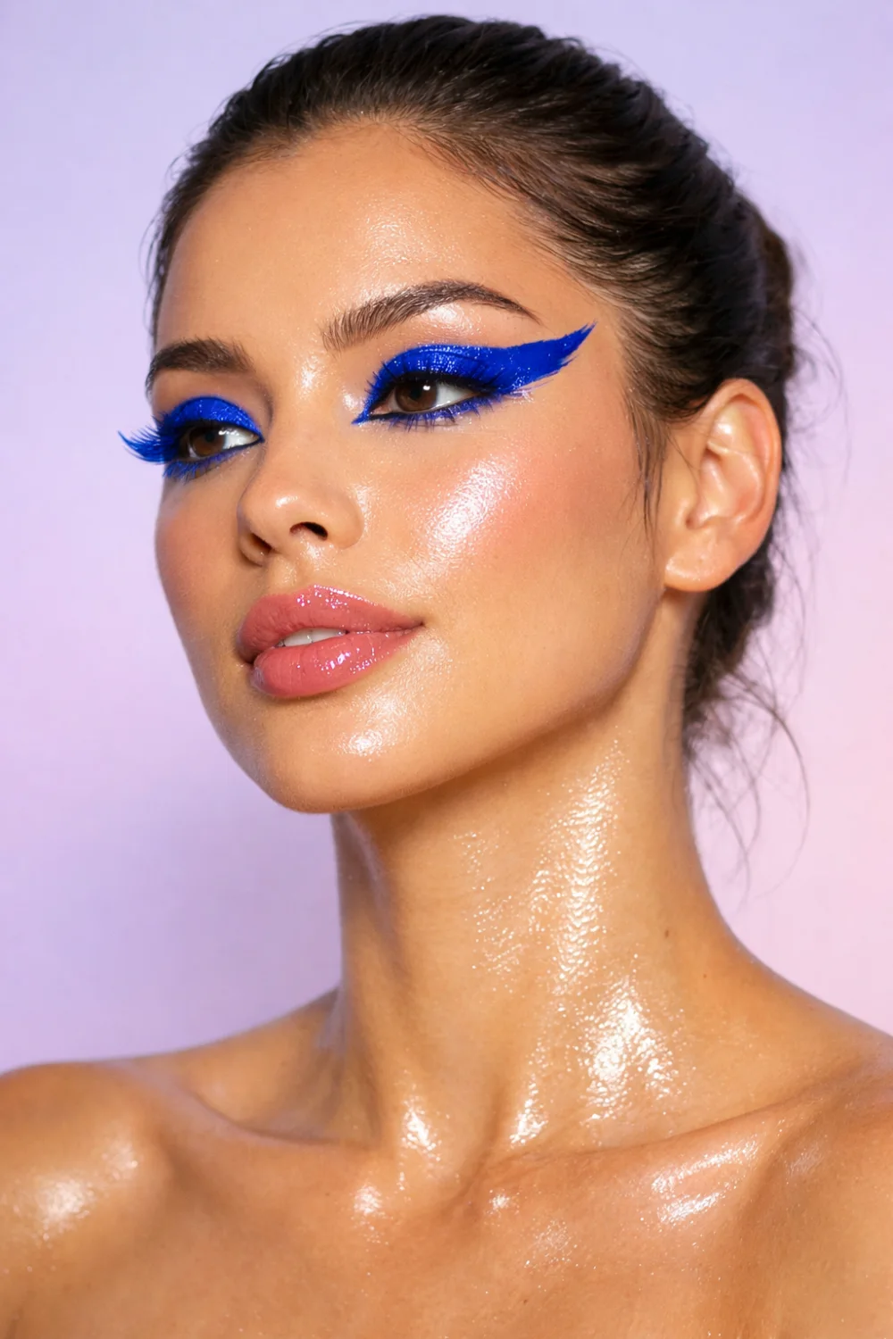 electric blue graphic eyeliner bold wing vibrant eye makeup summer glam look
