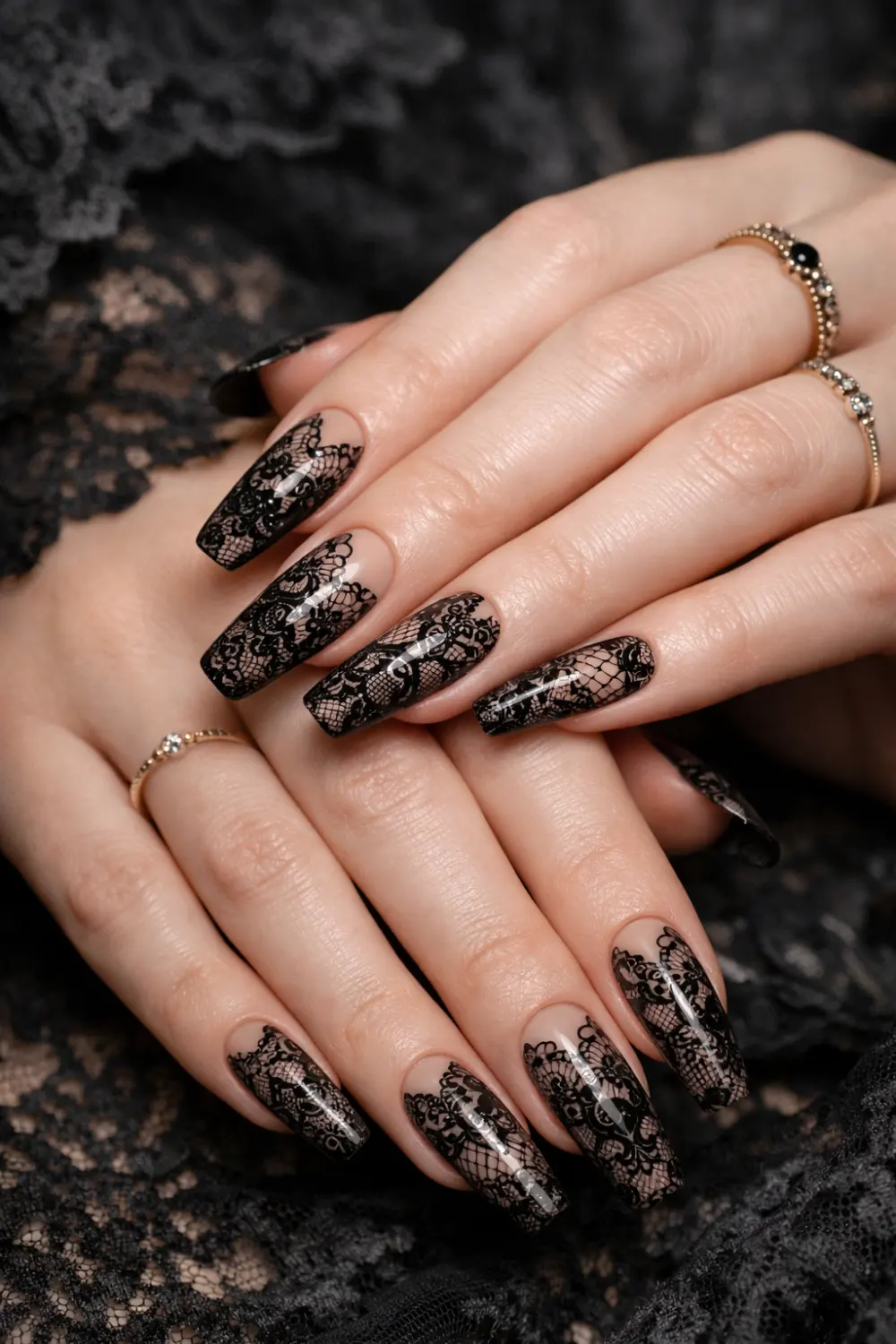 Gothic lace coffin nails with black lace nail art over nude base, elegant romantic dark glam manicure with intricate lace pattern perfect for gothic aesthetic nail inspiration.