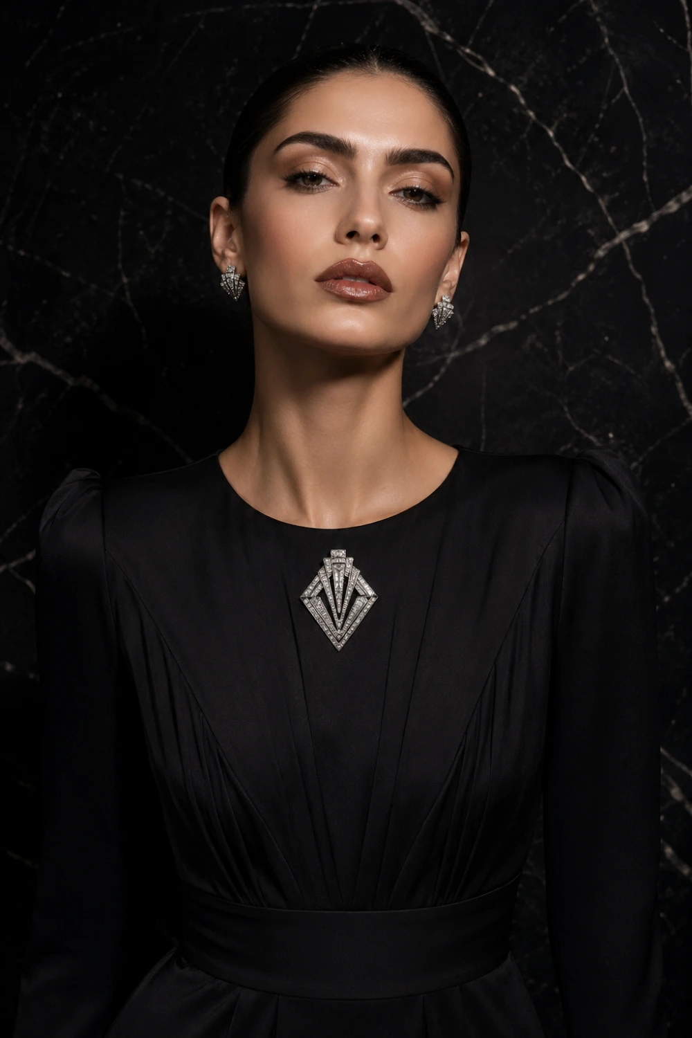 Fashion model wearing a sleek black dress with an Art Deco geometric crystal brooch at the center chest, sharp lighting, modern luxury styling, bold symmetrical design