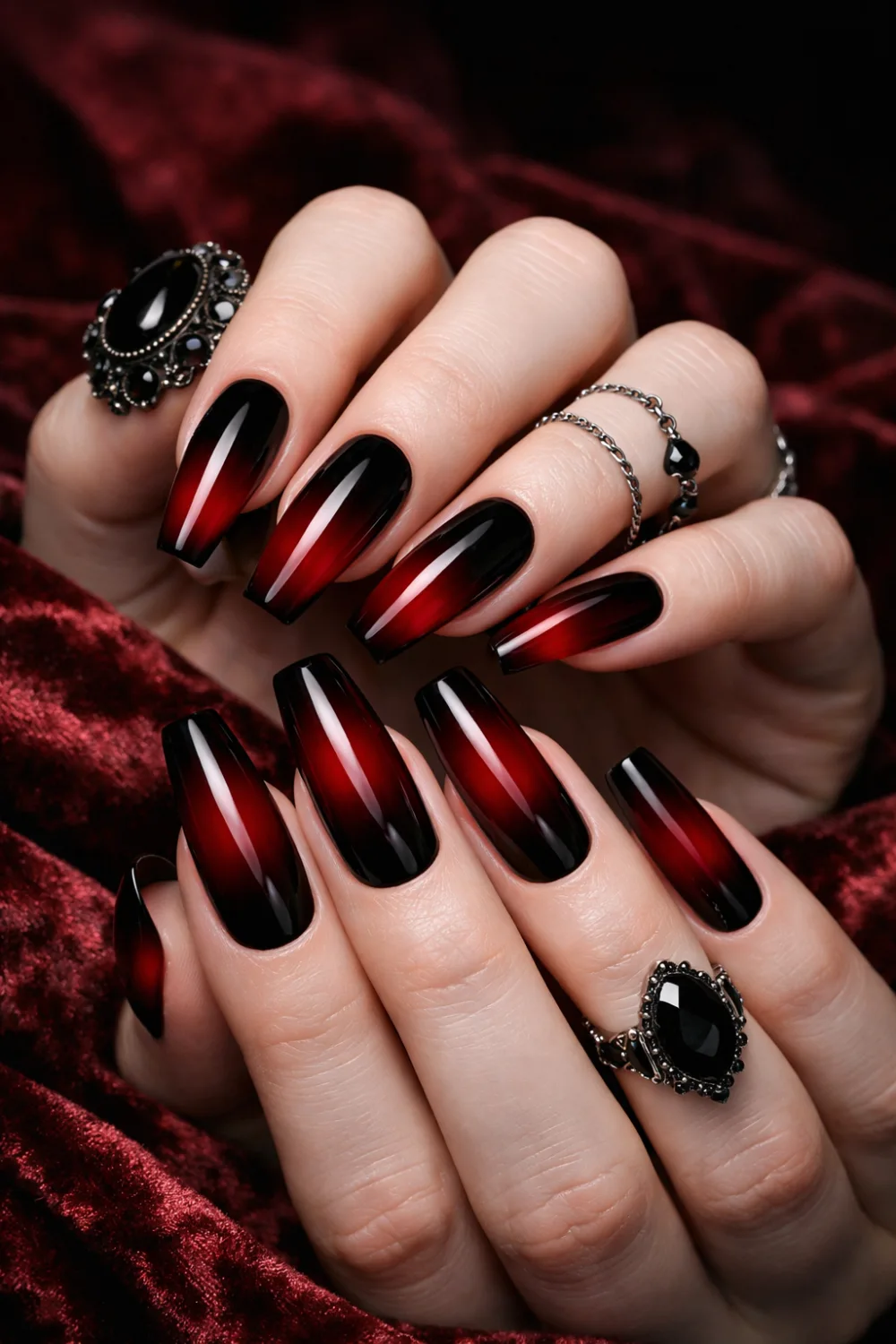 Black and red ombre coffin nails with glossy finish, dramatic gothic manicure featuring deep crimson gradient on long coffin shaped nails perfect for dark glam nail inspiration.