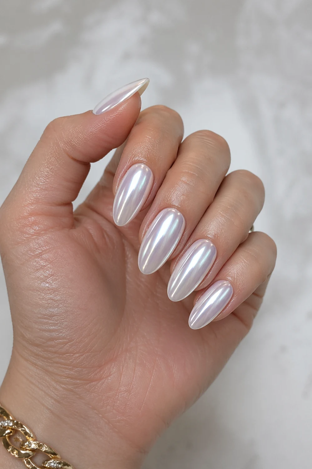 chrome milk bath nails glazed donut effect reflective pearl shine milky base glossy almond nails modern aesthetic manicure 2026