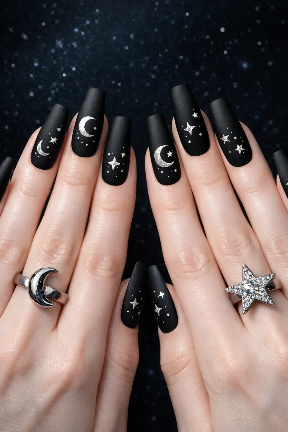 Celestial gothic coffin nails with moon and star nail art on matte black nails, witchy dark aesthetic manicure perfect for gothic beauty and celestial nail inspiration.