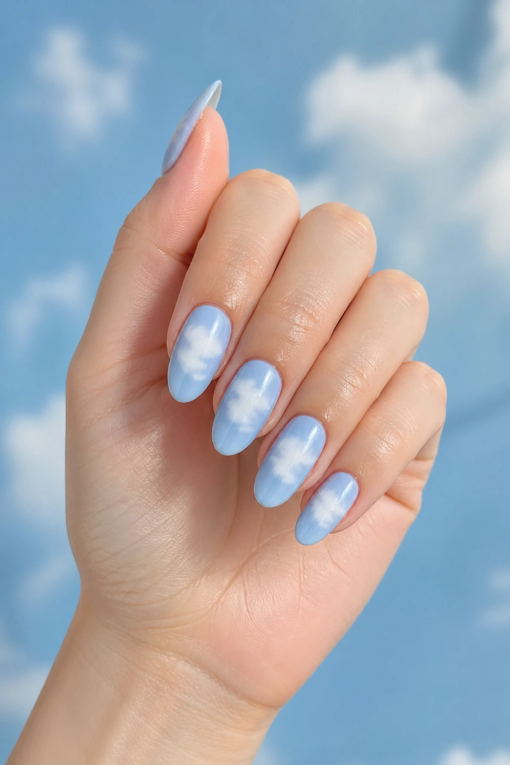 baby blue cloud halo nails pastel blue gel nails soft cloud aura effect dreamy sky inspired manicure cute aesthetic nails glossy finish
