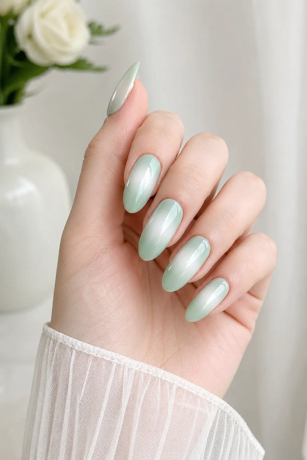 mint green milky halo nails glossy almond gel nails soft green gradient fade into milky center fresh minimal manicure pastel nail trend