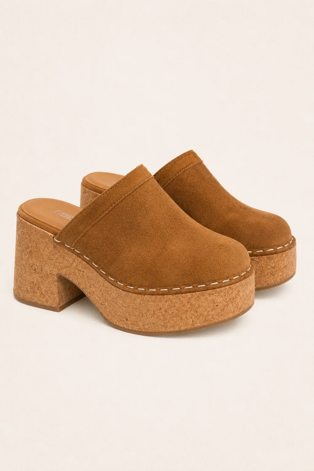 Ultra realistic chunky suede cork platform mule clogs in warm camel brown color with soft suede texture, thick cork sole, cozy neutral fashion aesthetic, modern Scandinavian-inspired style, trendy Pinterest platform mule shoes for 2026 fashion outfits.