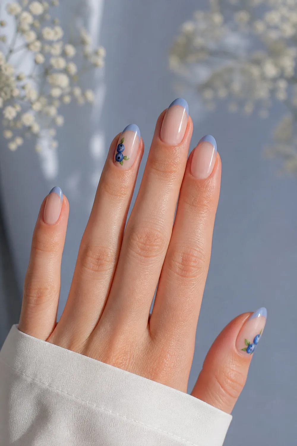 blueberry french tip nails pastel blue tips nude base tiny blueberry nail art almond shape spring aesthetic manicure soft light