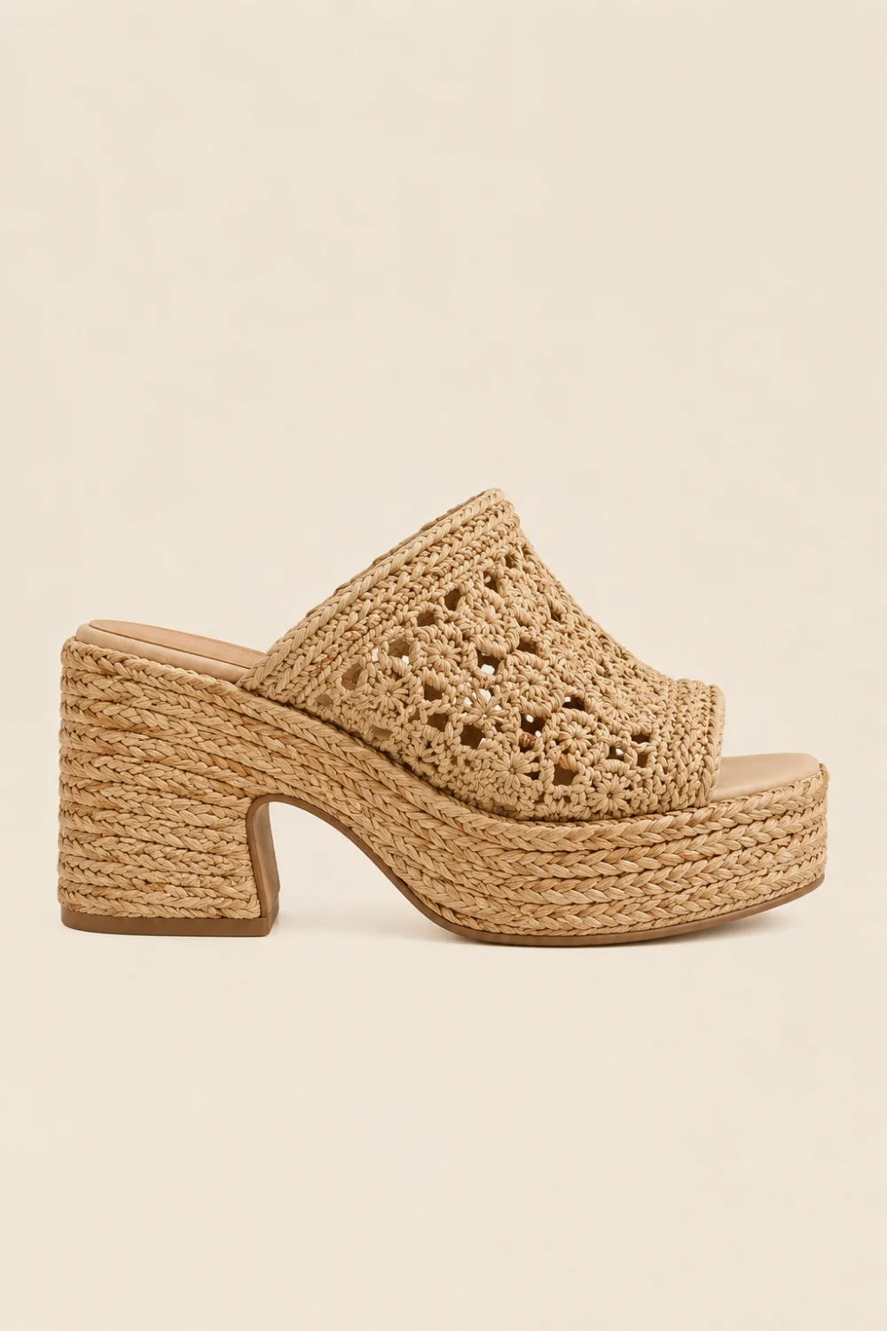 Woven crochet platform mule sandals in natural beige tones with braided raffia texture, chunky woven heel, boho luxury fashion aesthetic, trendy Pinterest summer mule sandals for resort and vacation outfits.