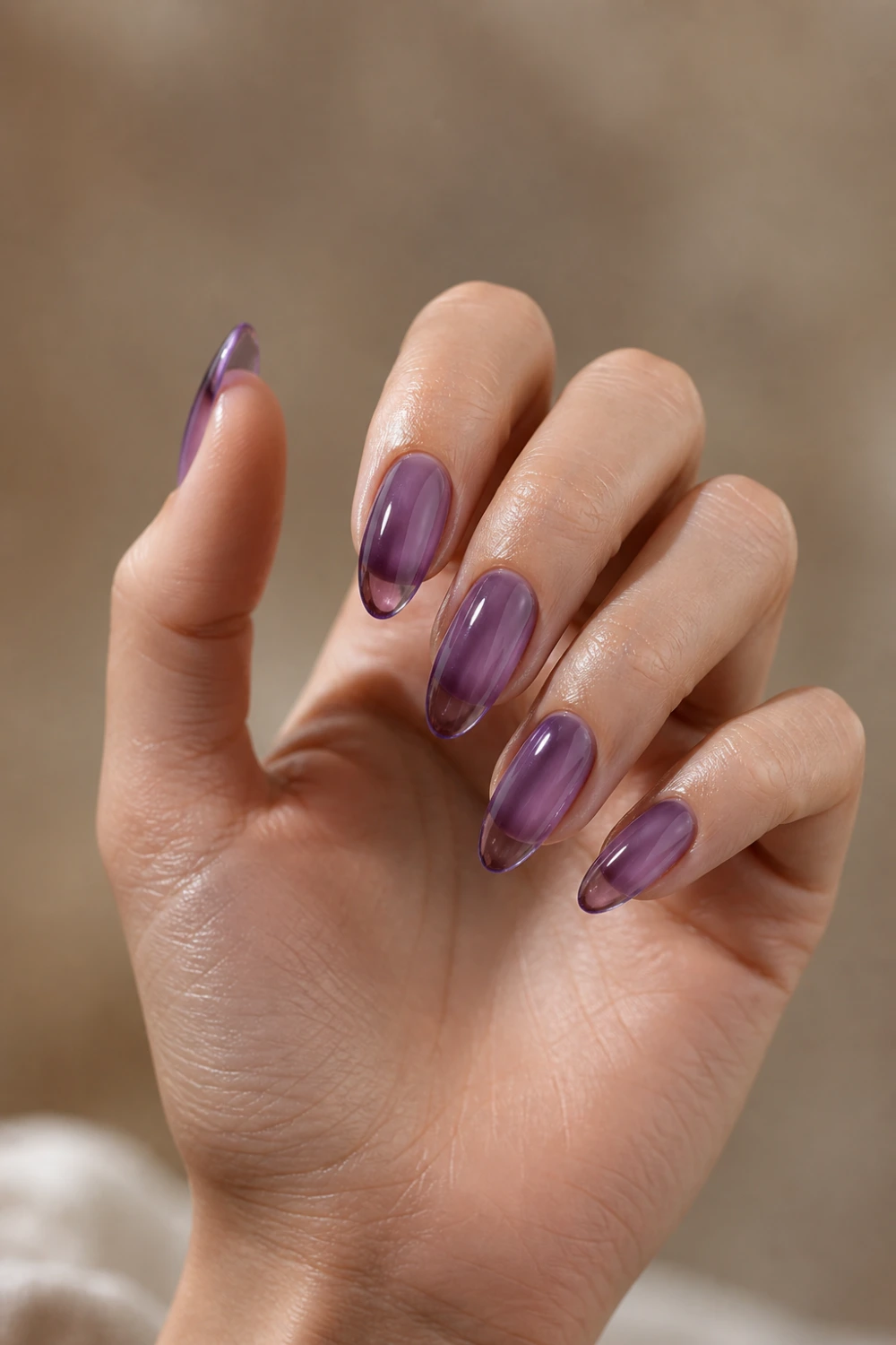grape jelly nails translucent purple glossy gel nails glass effect almond shape shiny aesthetic manicure soft lighting close up