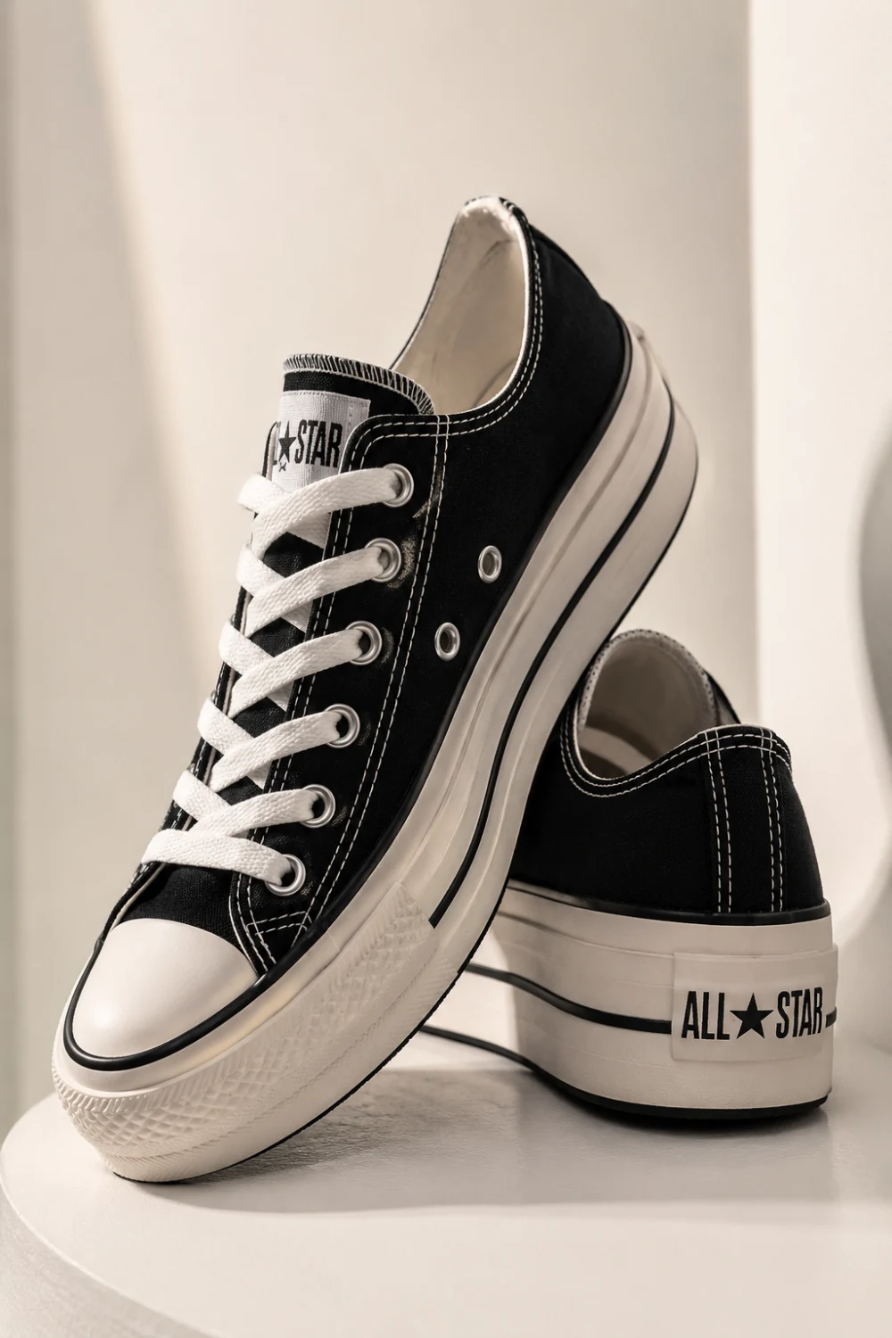 Black and white Converse platform women sneakers with classic canvas design and elevated sole styled in trendy casual streetwear and Korean fashion aesthetic for everyday outfits.