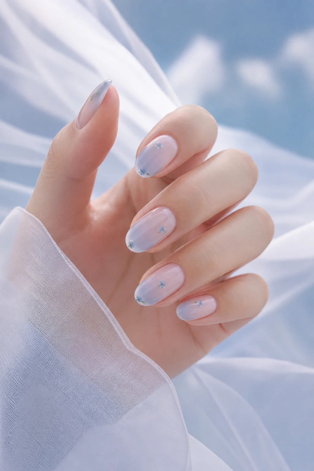 baby blue gradient nails with tiny micro floral accents, soft ombre manicure, glossy finish, pastel aesthetic close up